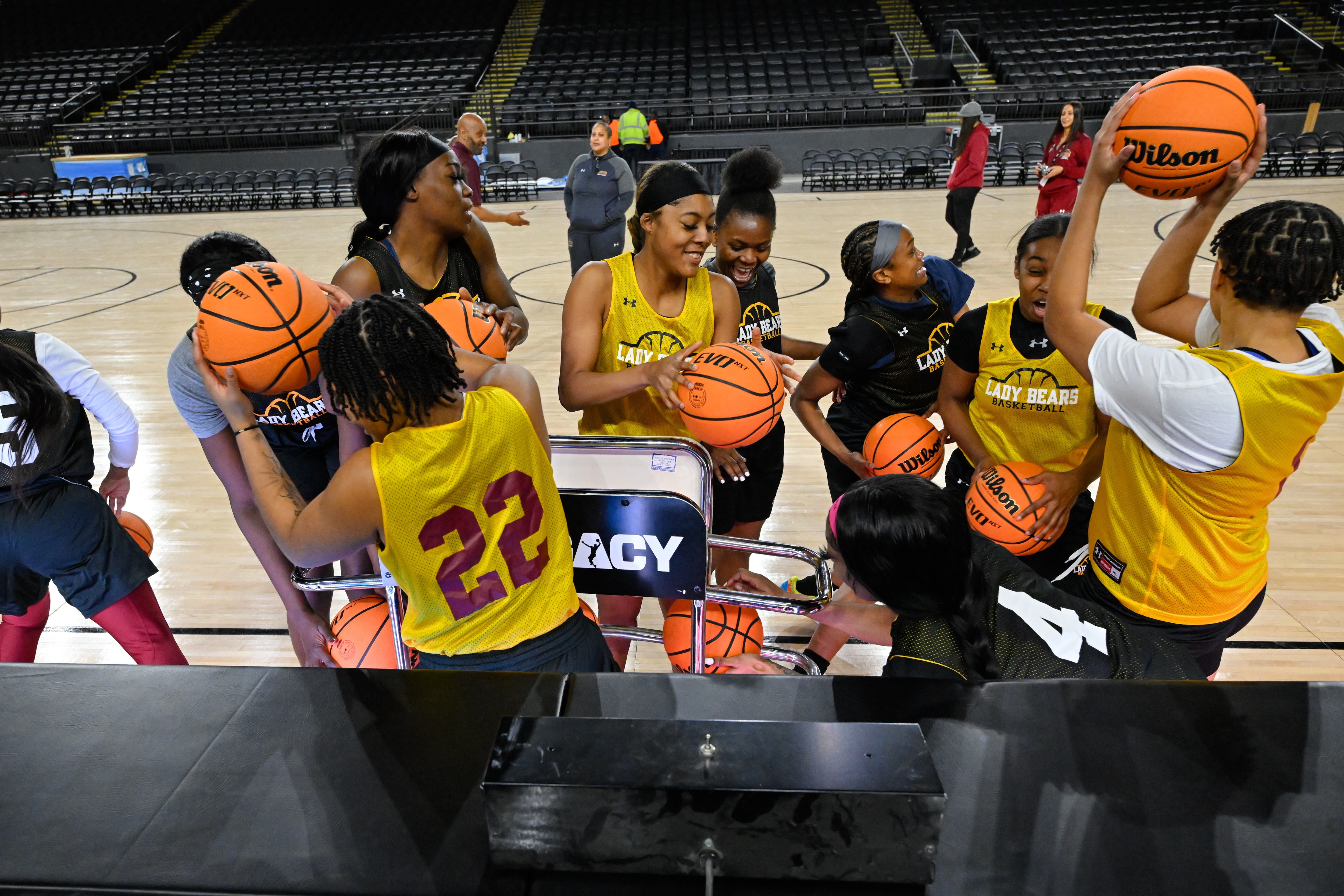 Players from Shaw University women’s basketball team grabs basketballs from a ball rack before practice for the CIAA NCAA basketball tournament at CFG Bank Arena, Sunday, Feb. 19, 2023, in Baltimore.