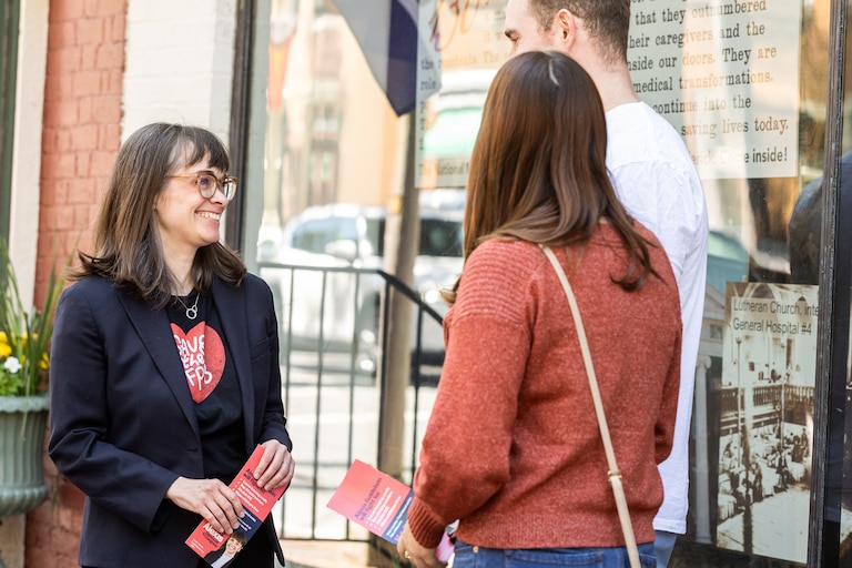 Alexis Goldstein speaks with voters in downtown Frederick on May 12, 2026. Goldstein is running in the Democratic primary for the 6th Congressional District.