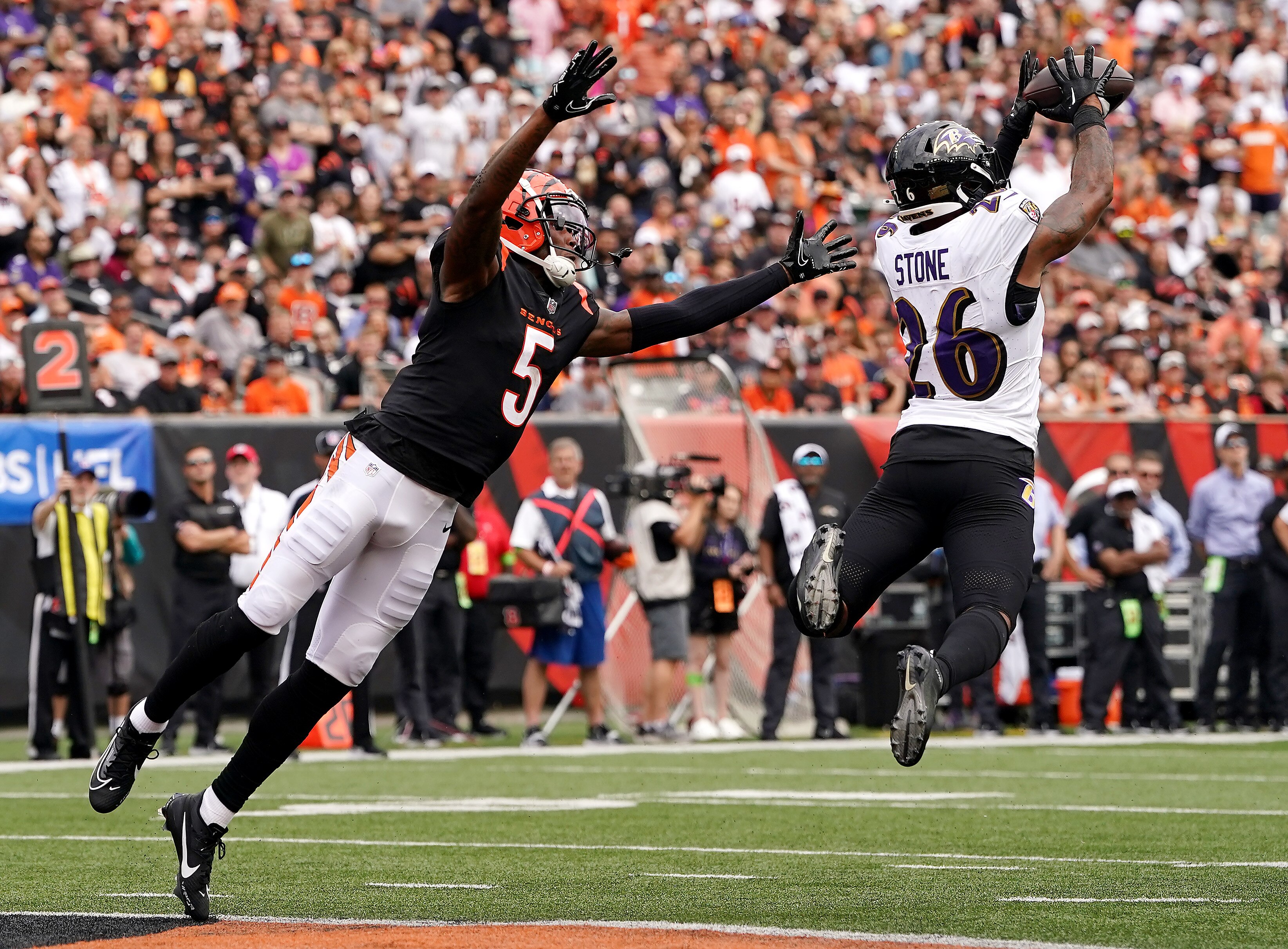 CINCINNATI, OHIO - SEPTEMBER 17: Geno Stone #26 of the Baltimore Ravens intercepts a pass intended for Tee Higgins #5 of the Cincinnati Bengals during the third quarter at Paycor Stadium on September 17, 2023 in Cincinnati, Ohio. (Photo by Dylan Buell/Getty Images)