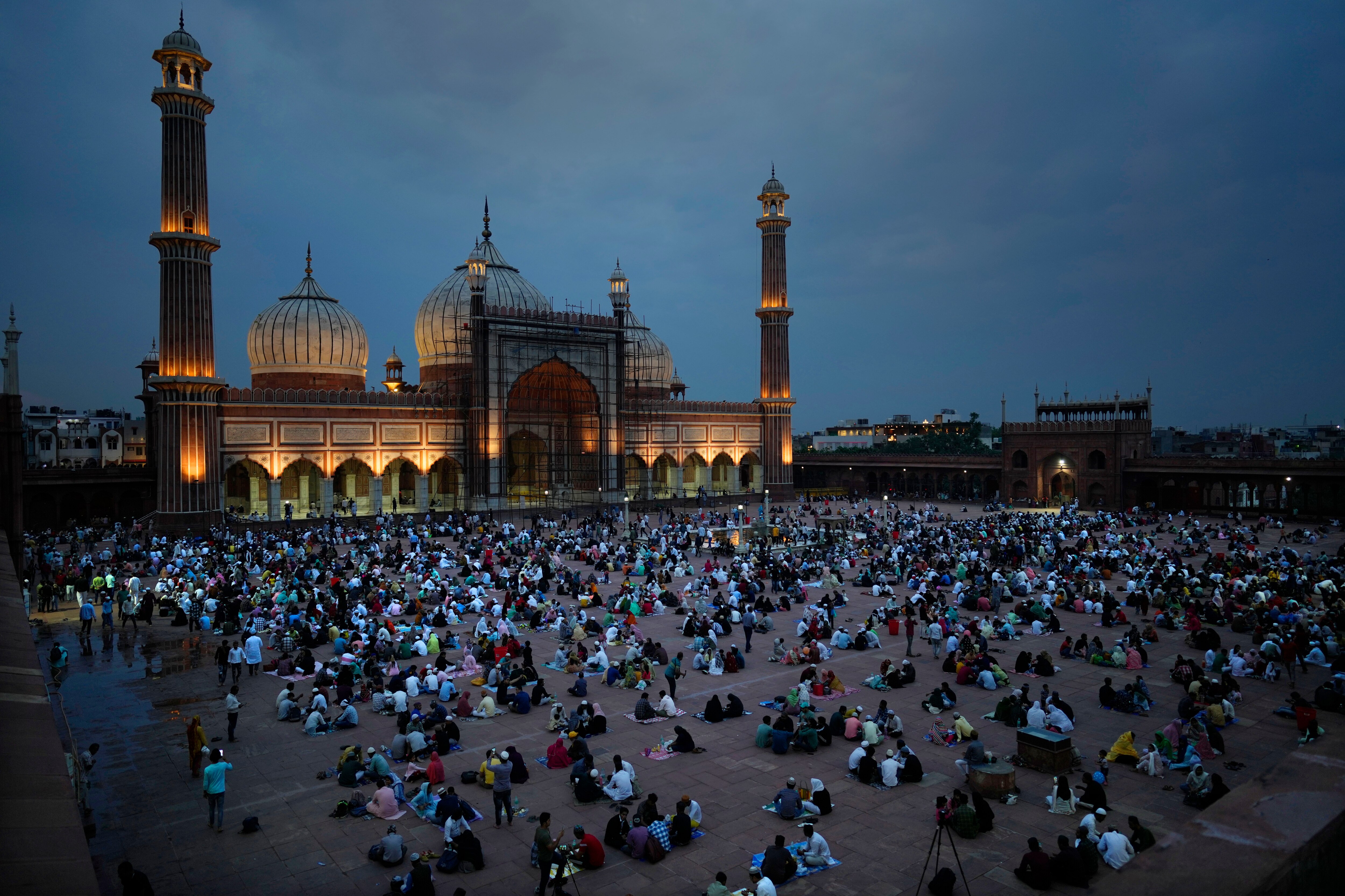 Muslims break their fast on the first day of the holy fasting month of Ramadan at the Jama Masjid, in New Delhi, India, Friday, March 24, 2023. Islam's holiest month is a period of intense prayer, dawn-to-dusk fasting and nightly feasts. Photo by Manish Swarup/Associated Press