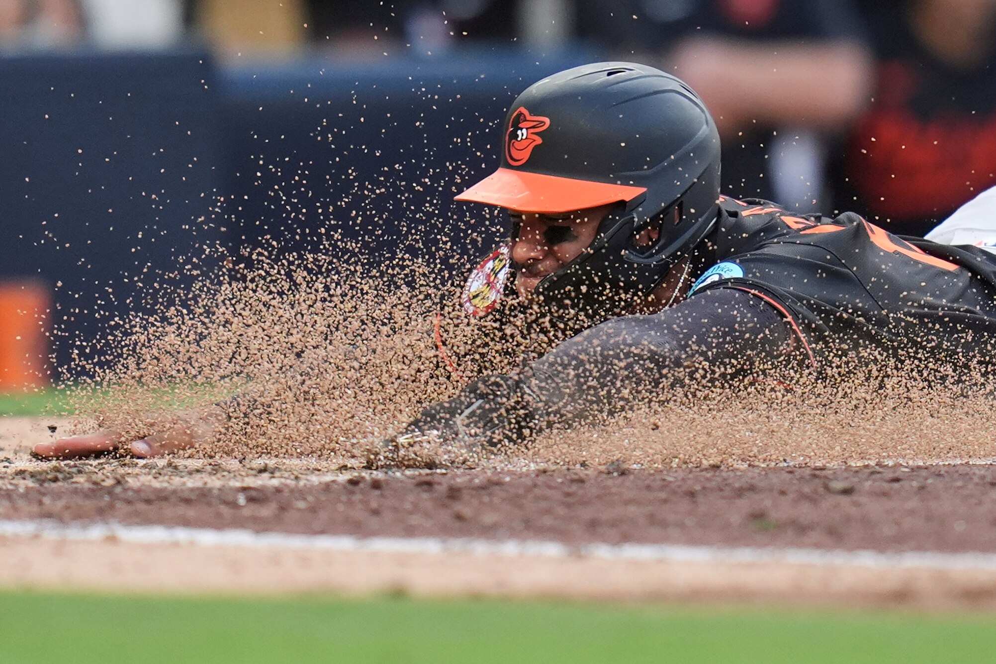 Jeremiah Jackson slides in to home, scoring off an RBI single by Dylan Beavers during the seventh inning