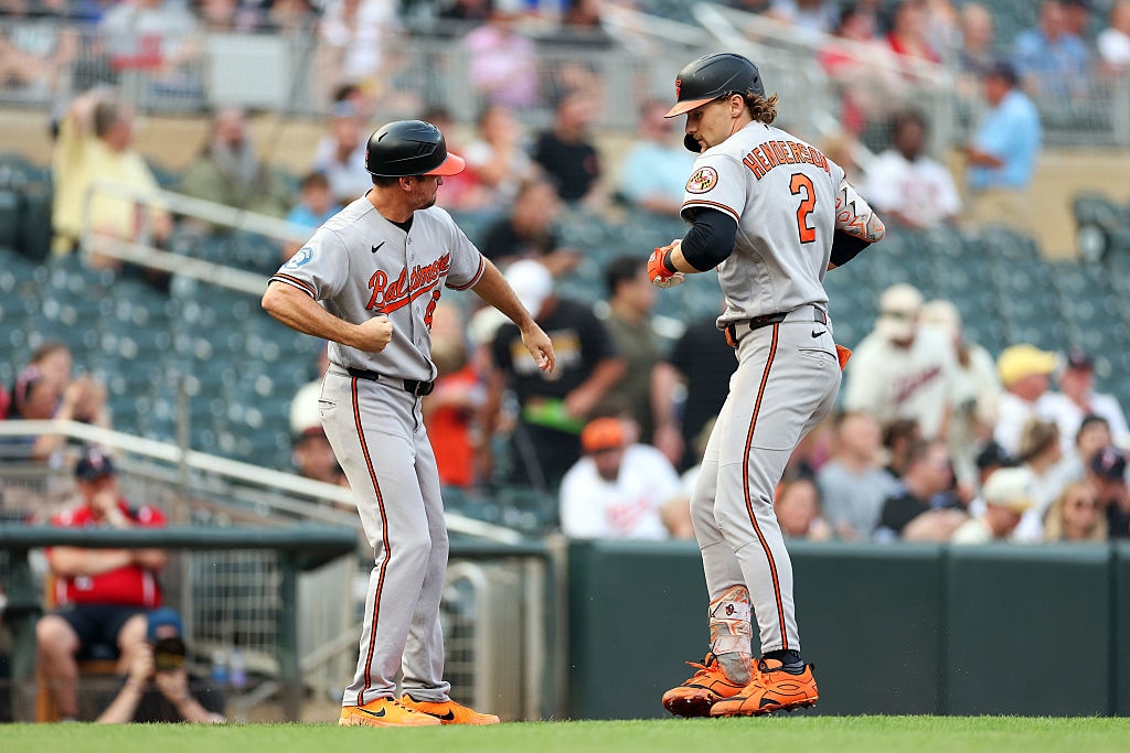 Gunnar Henderson celebrates his two-run home run with third base coach Buck Britton as he rounds the bases in the second inning.