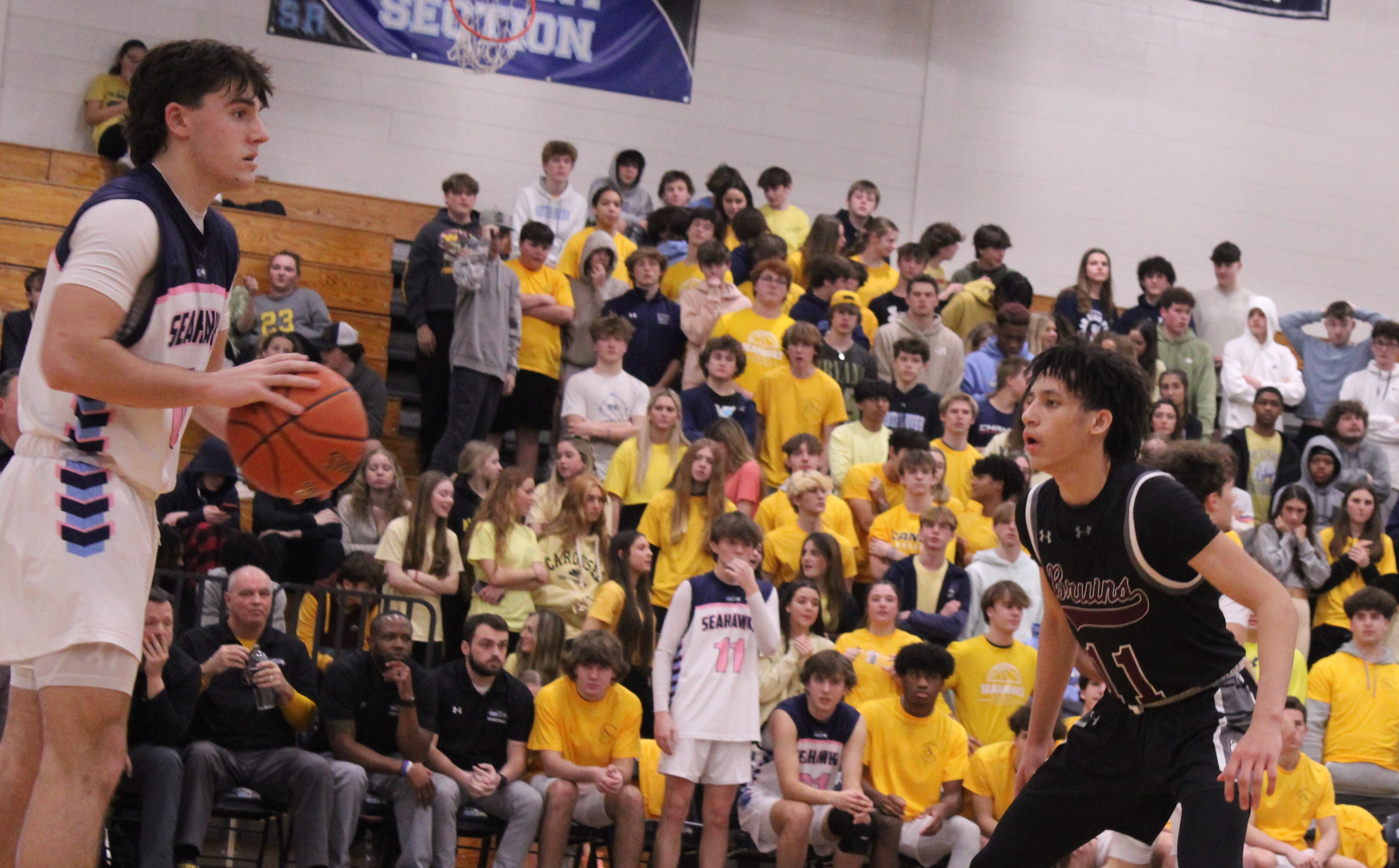 Broadneck guard Jordan Brown (right) defends South River's Blake Burrows during the fourth quarter of Friday's win by the Bruins in Edgewater. Broadneck solidfield its hold on second-place in the Anne Arundel County boys basketball standings with a 60-55 victory.