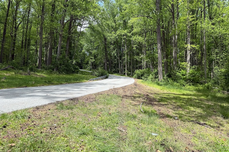 SATURDAY, MAY 2, 2026 - The steep bend just before the vehicle involved in a crash at the intersection of Poplar Hill Road and Merrymans Mill Road in Cockeysville on Friday night that left three juveniles injured and one adult dead skidded off of Poplar Hill Road.