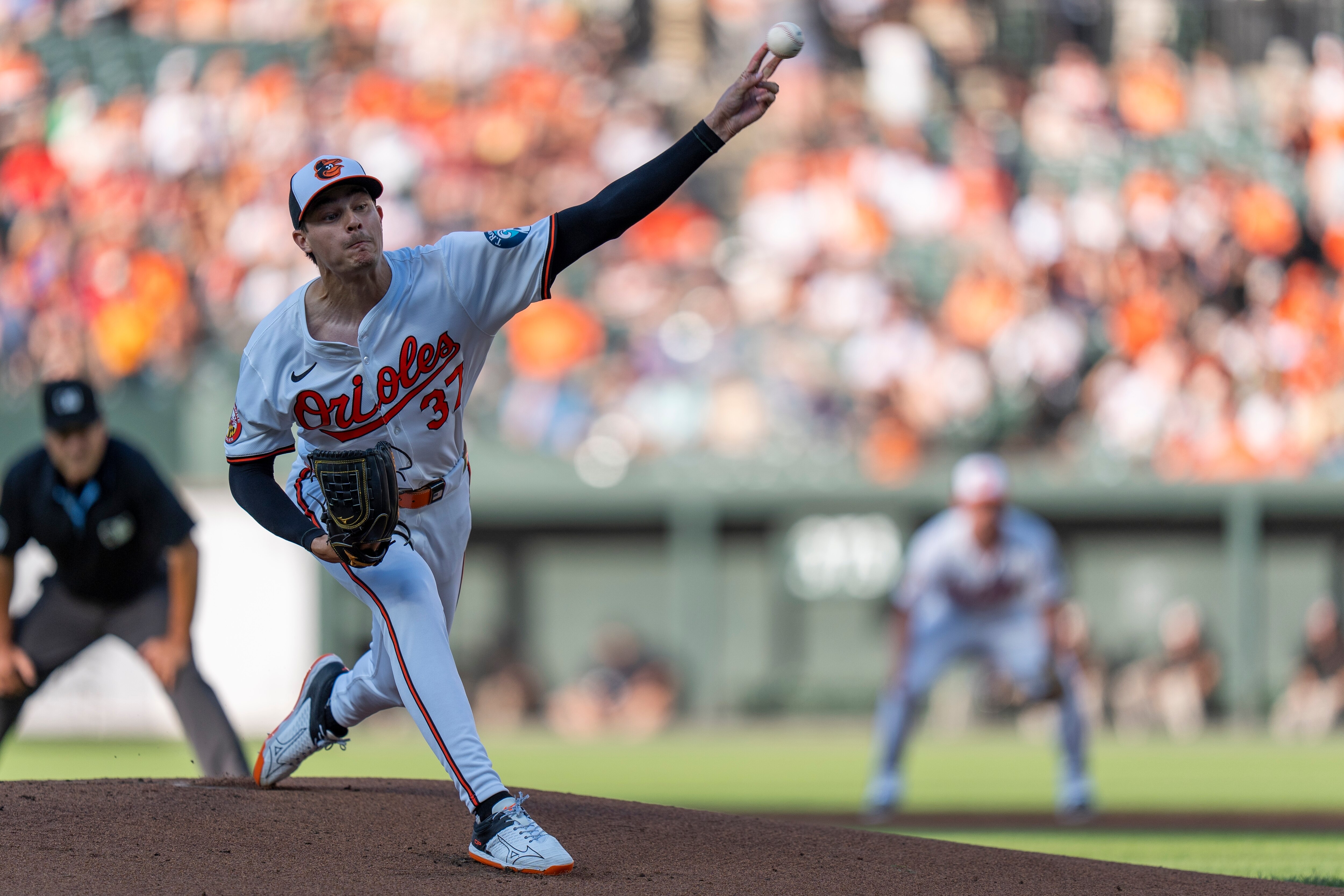 Baltimore Orioles starting pitcher Cade Povich (37) delivers a pitch during the first inning of a game against the Cleveland Guardians. (AP Photo/Stephanie Scarbrough)