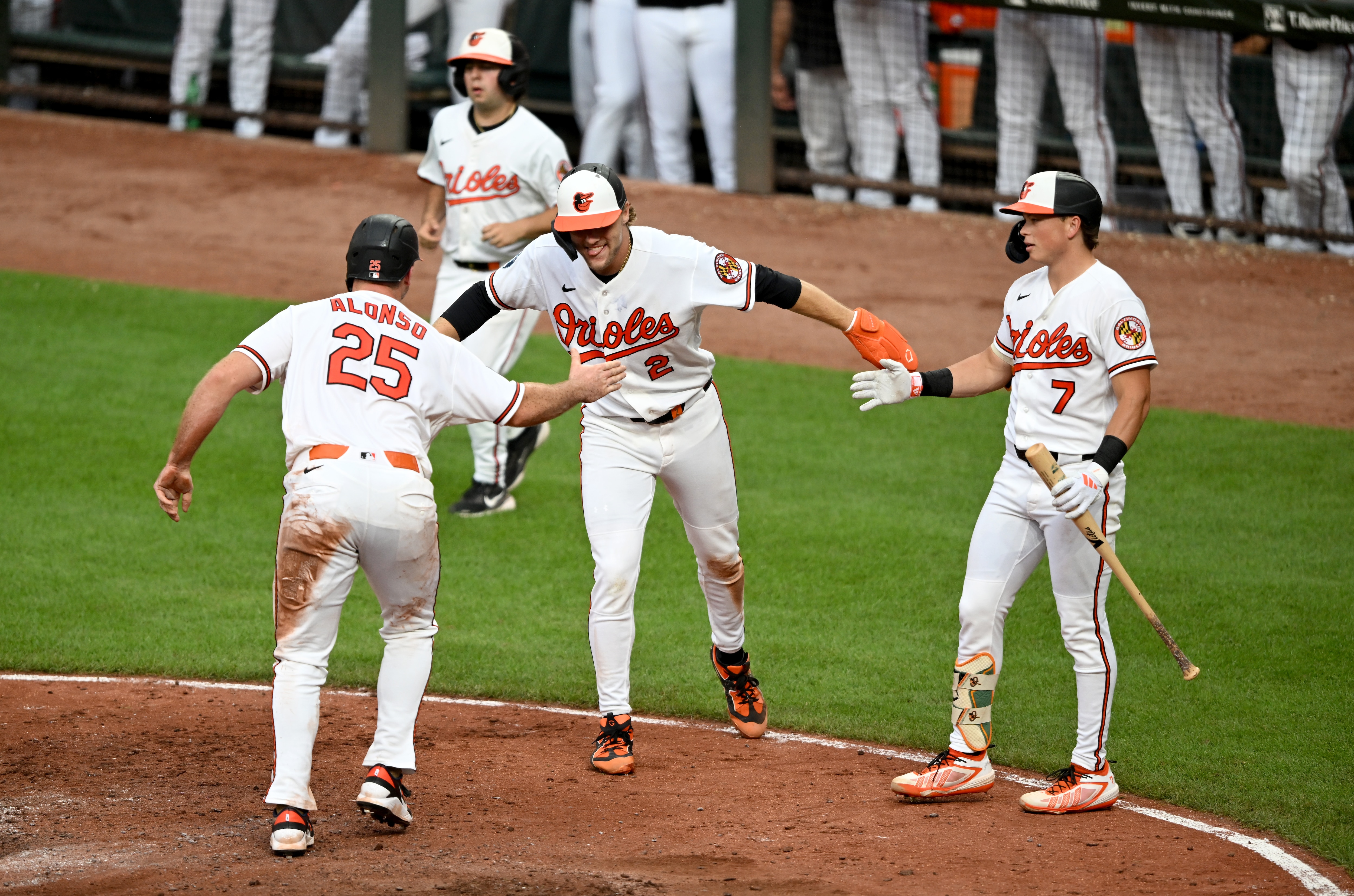 Pete Alonso of the Orioles celebrates with Gunnar Henderson and Jackson Holliday after scoring against the Cubs in Baltimore this year.