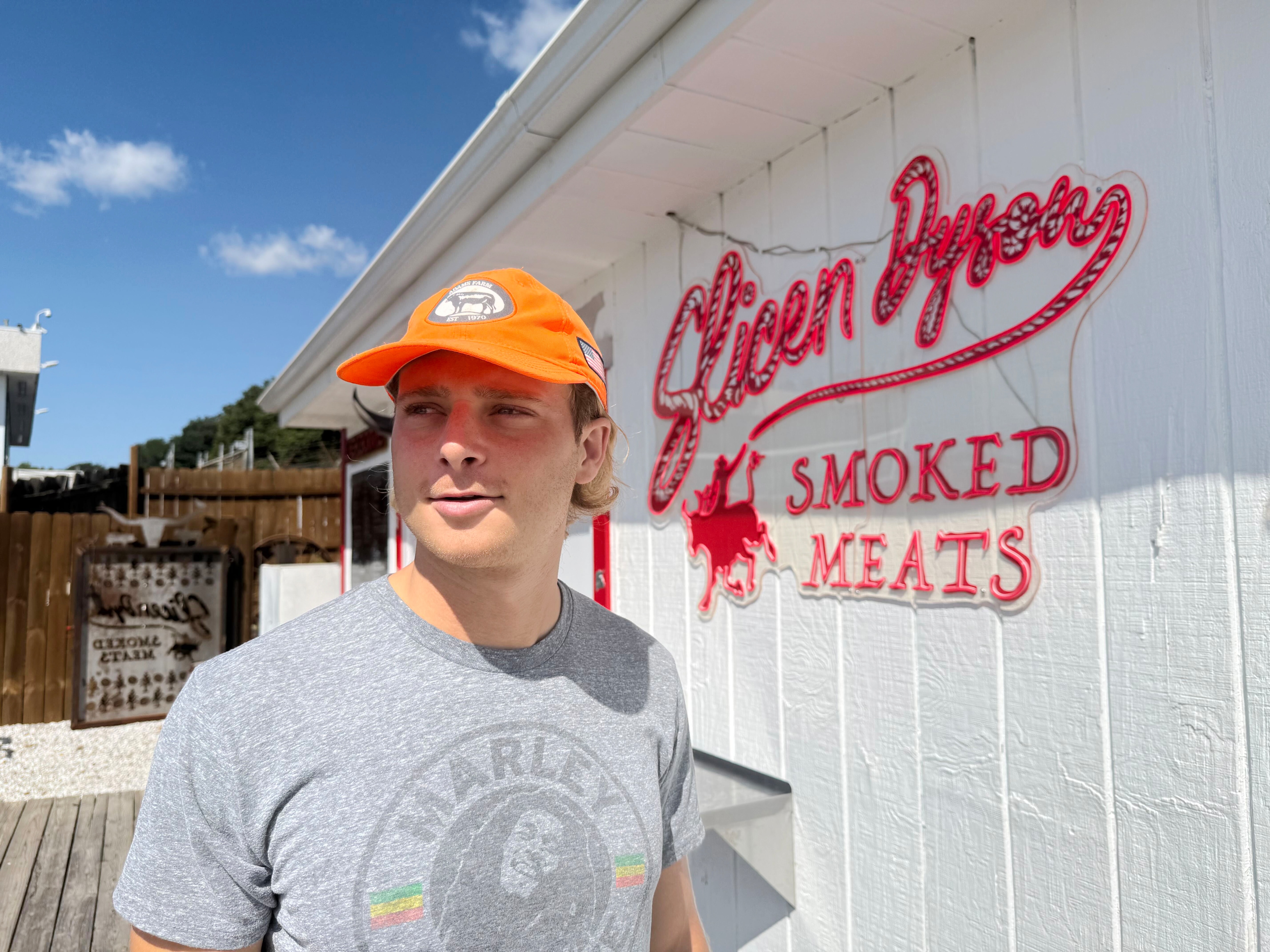 Dyson Adams’ Slicen Dyson barbecue stand in Parkville has Baltimore County lining up for an hour-plus. Adams says he discovered his love for cooking after a 2019 injury forced him to quit drinking and prompted him to find spirituality.