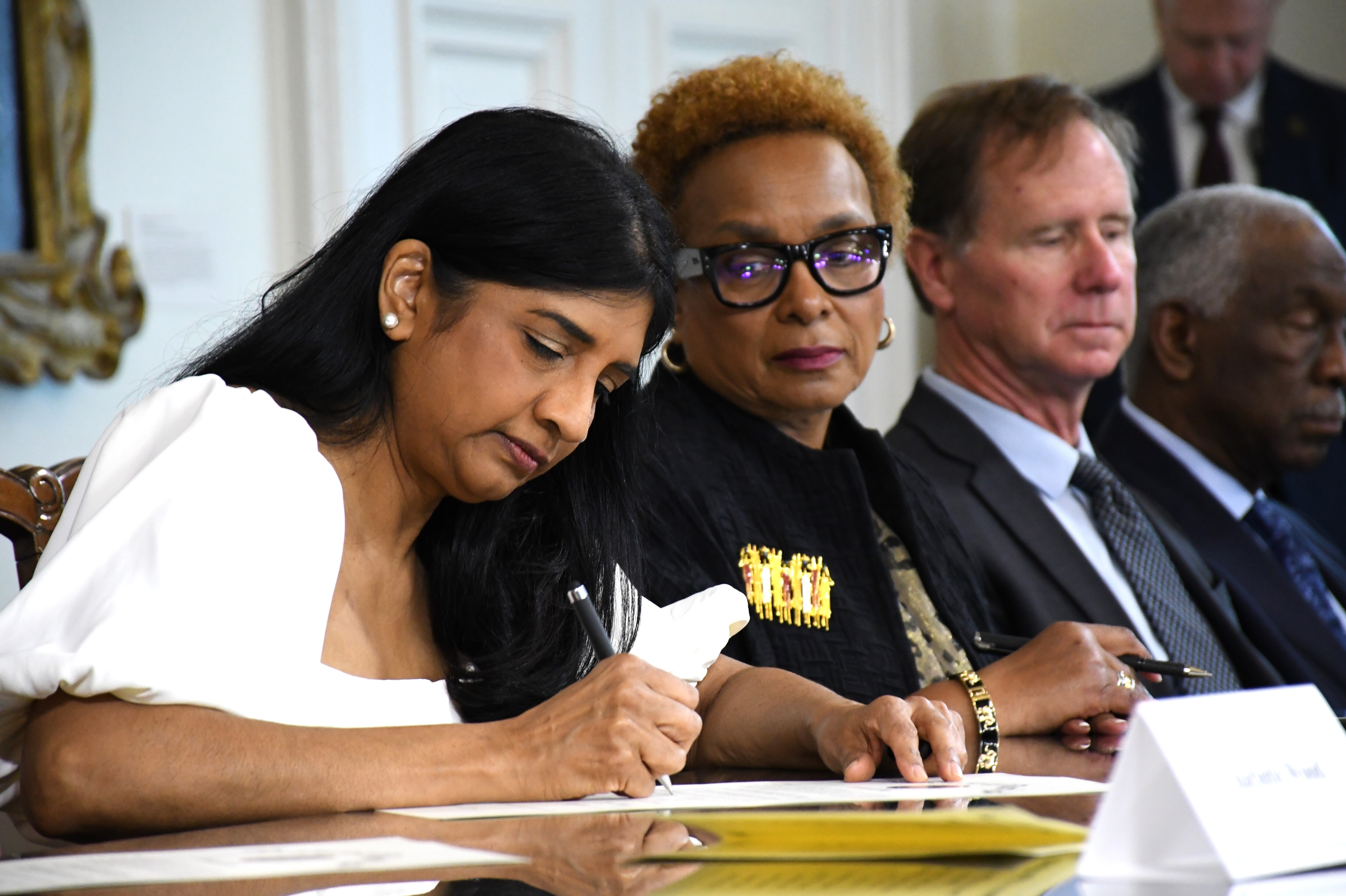 Lt. Gov. Aruna Miller signs documents making Maryland's votes for president official. Miller served as president of Maryland's Democratic presidential electors. The state's electors met at the State House in Annapolis on Tuesday, Dec. 17, 2024.