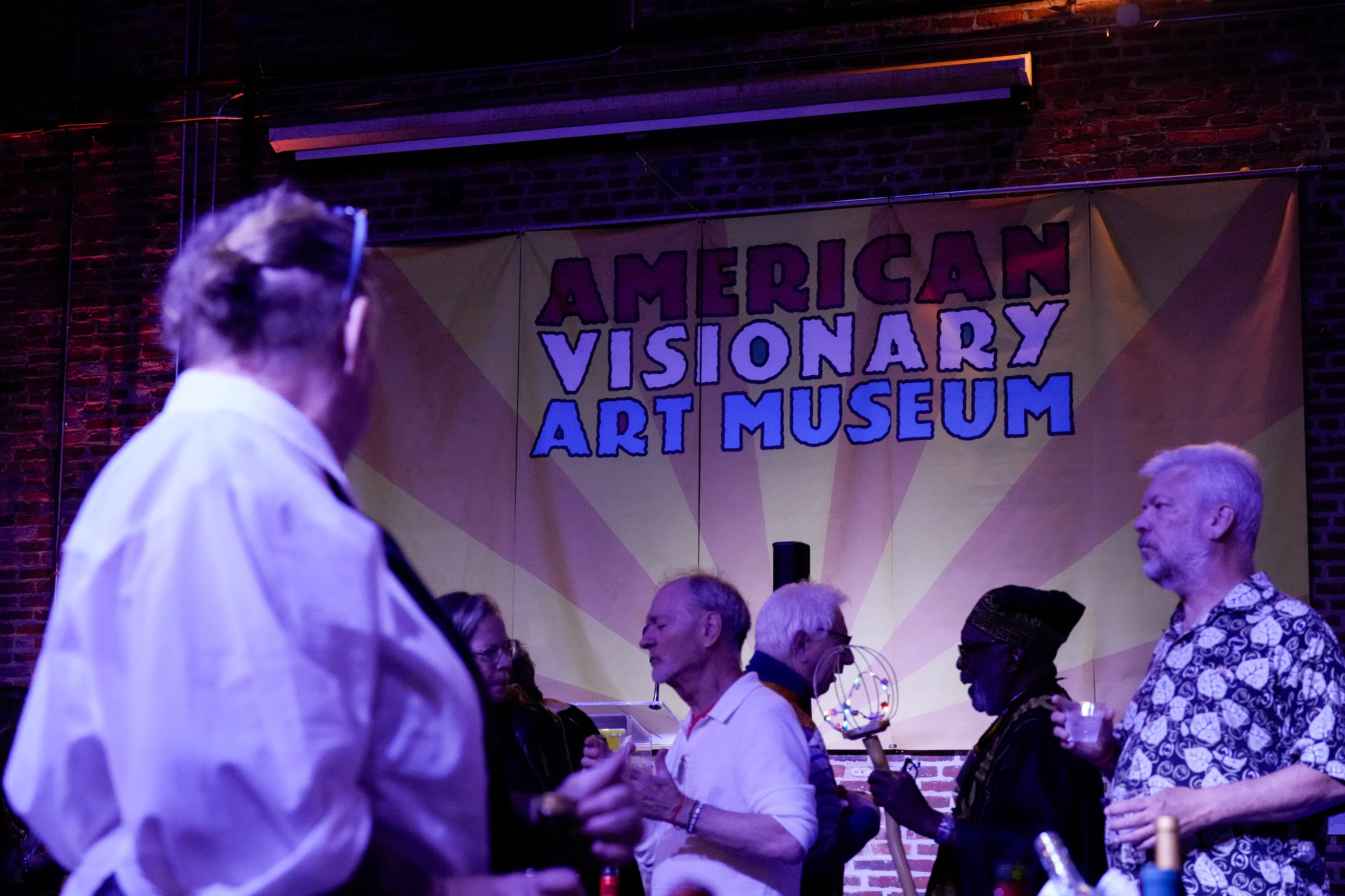 Guests poses for portraits and mingle during the opening night of the American Visionary Art Museum’s Fantastic Realities exhibit in the Federal Hill neighborhood of Baltimore, Md., on Friday, Oct. 3, 2025.