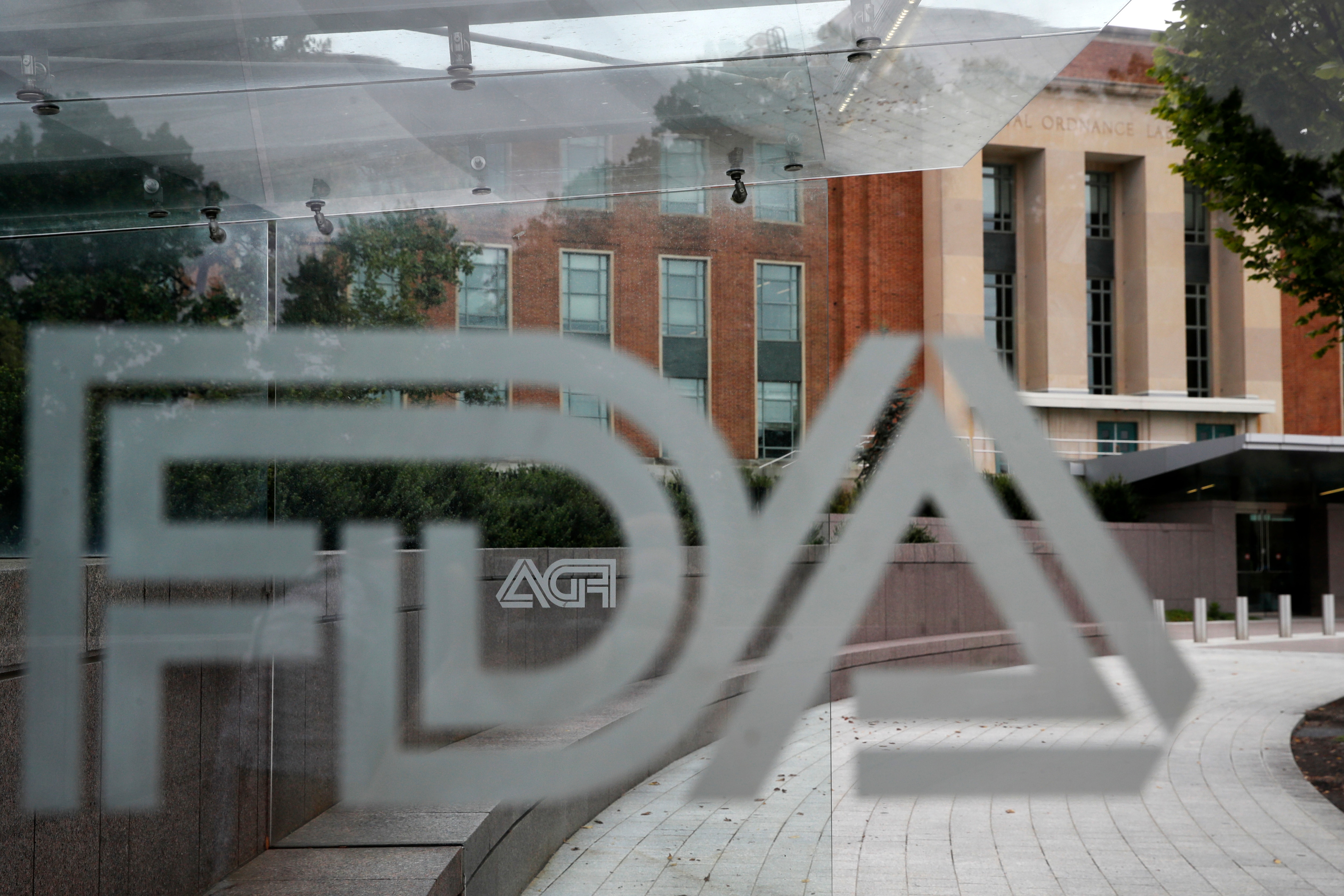 he U.S. Food and Drug Administration building behind FDA logos at a bus stop on the agency's campus