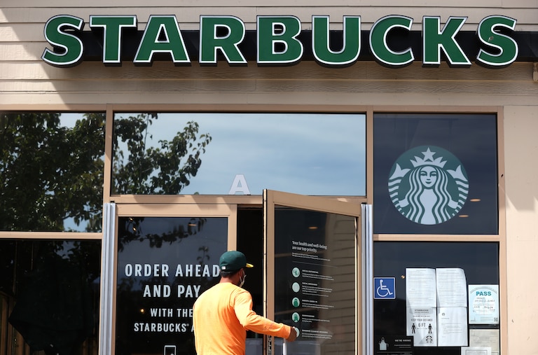 SAN RAFAEL, CALIFORNIA - JUNE 10: A customer enters a Starbucks Coffee store on June 10, 2020 in San Rafael, California. Starbucks announced plans to close 400 of its company owned cafes over the next 18 months as the coffee shop chain estimates losing over $3 billion due to the coronavirus COVID-19 pandemic. (Photo by Justin Sullivan/Getty Images)