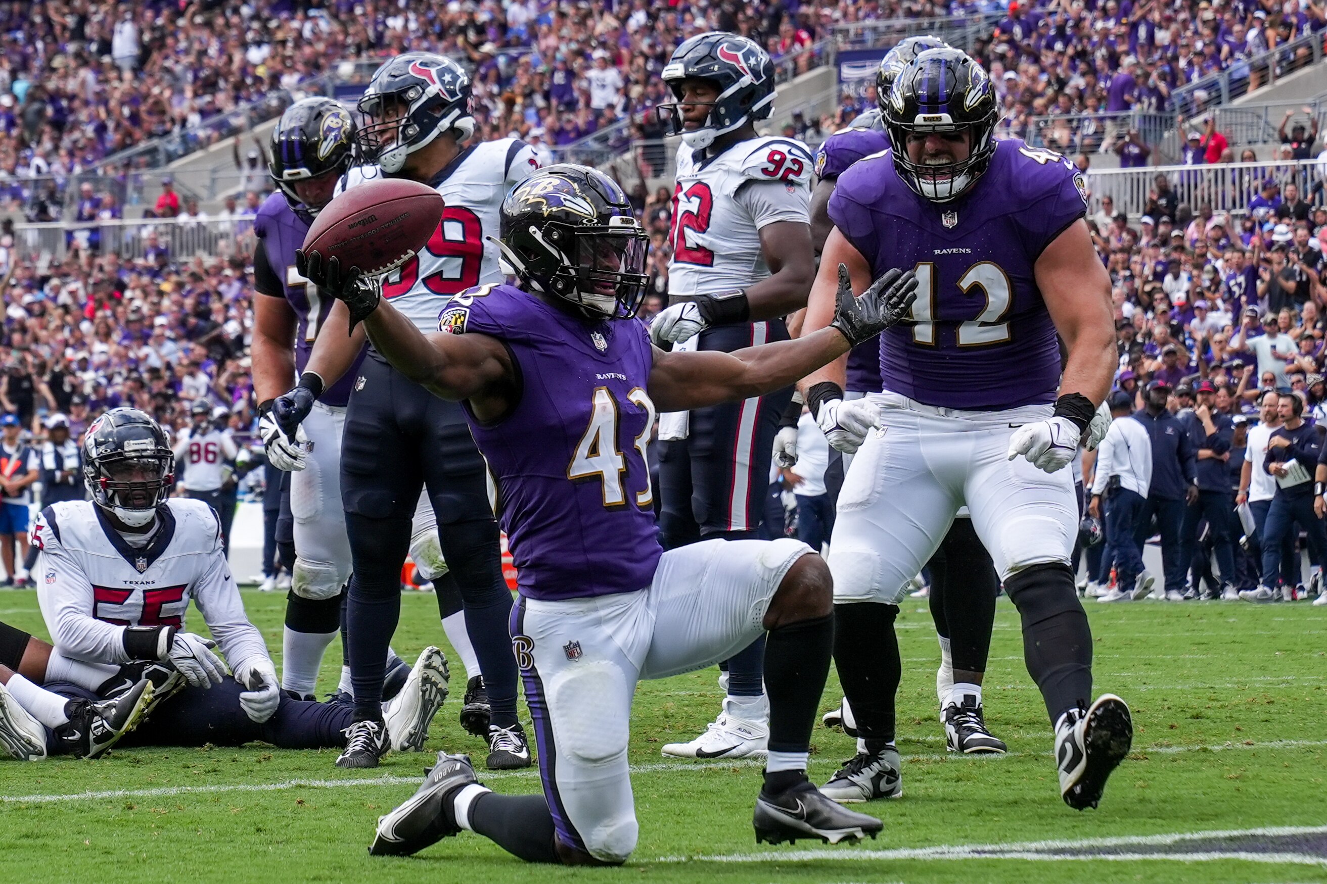 Running back Justice Hill scores one of his two 2-yard touchdowns during the third quarter of the Ravens’ 25-9 win over the Texans in the season opener.