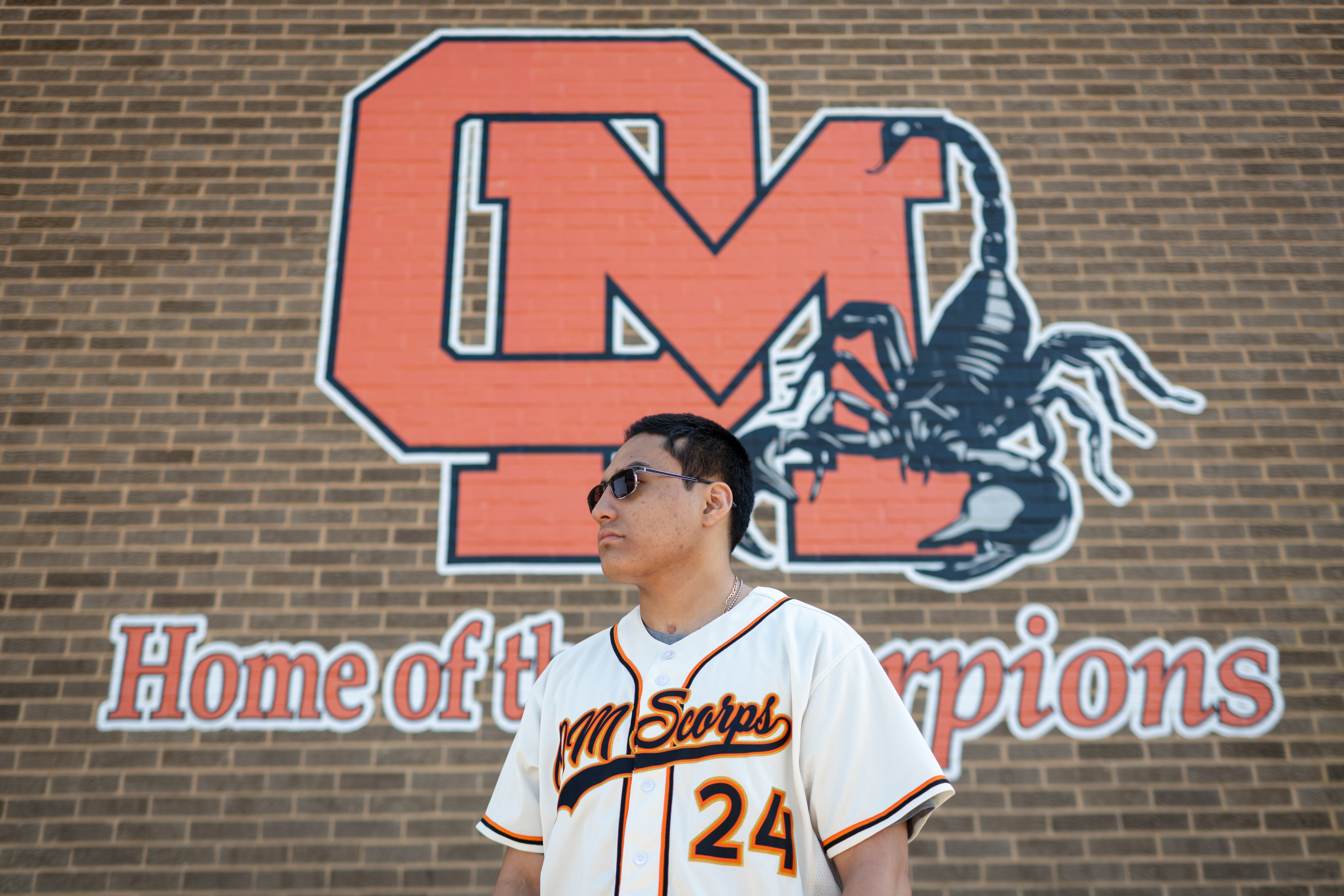 Alex Morales, a graduating senior from Oakland Mills High School, stands outside the school campus on May 2 in Columbia.