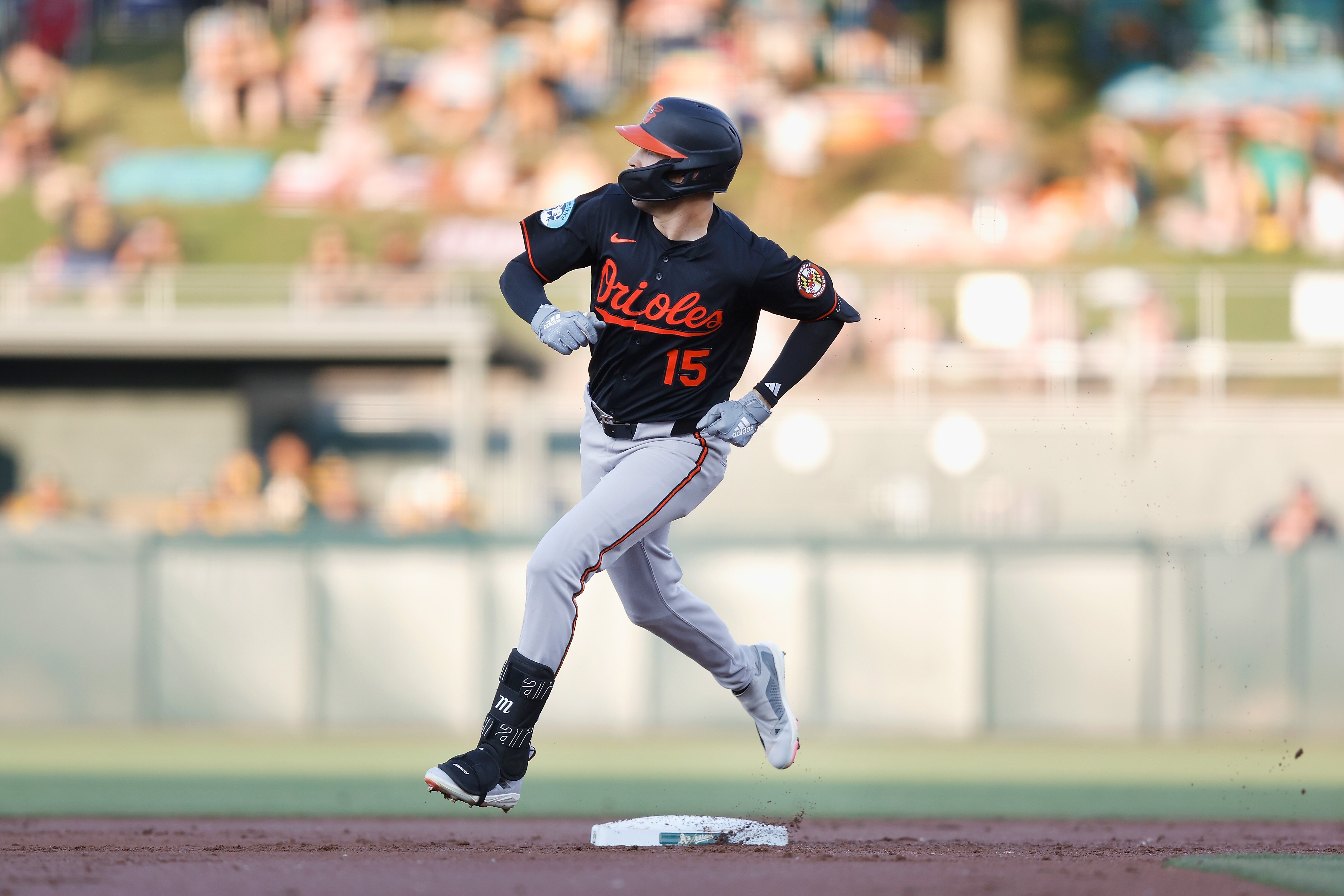 Dylan Carlson of the Orioles rounds the bases after hitting a two-run home run in the top of the second inning Friday night against the Athletics in Sacramento, Calif.
