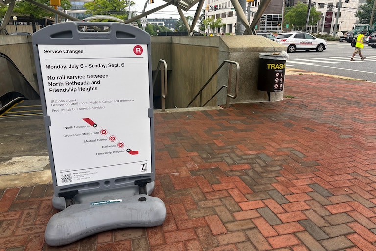 A sign outside the North Bethesda Metro station outlines the Red Line station closure map for the summer.