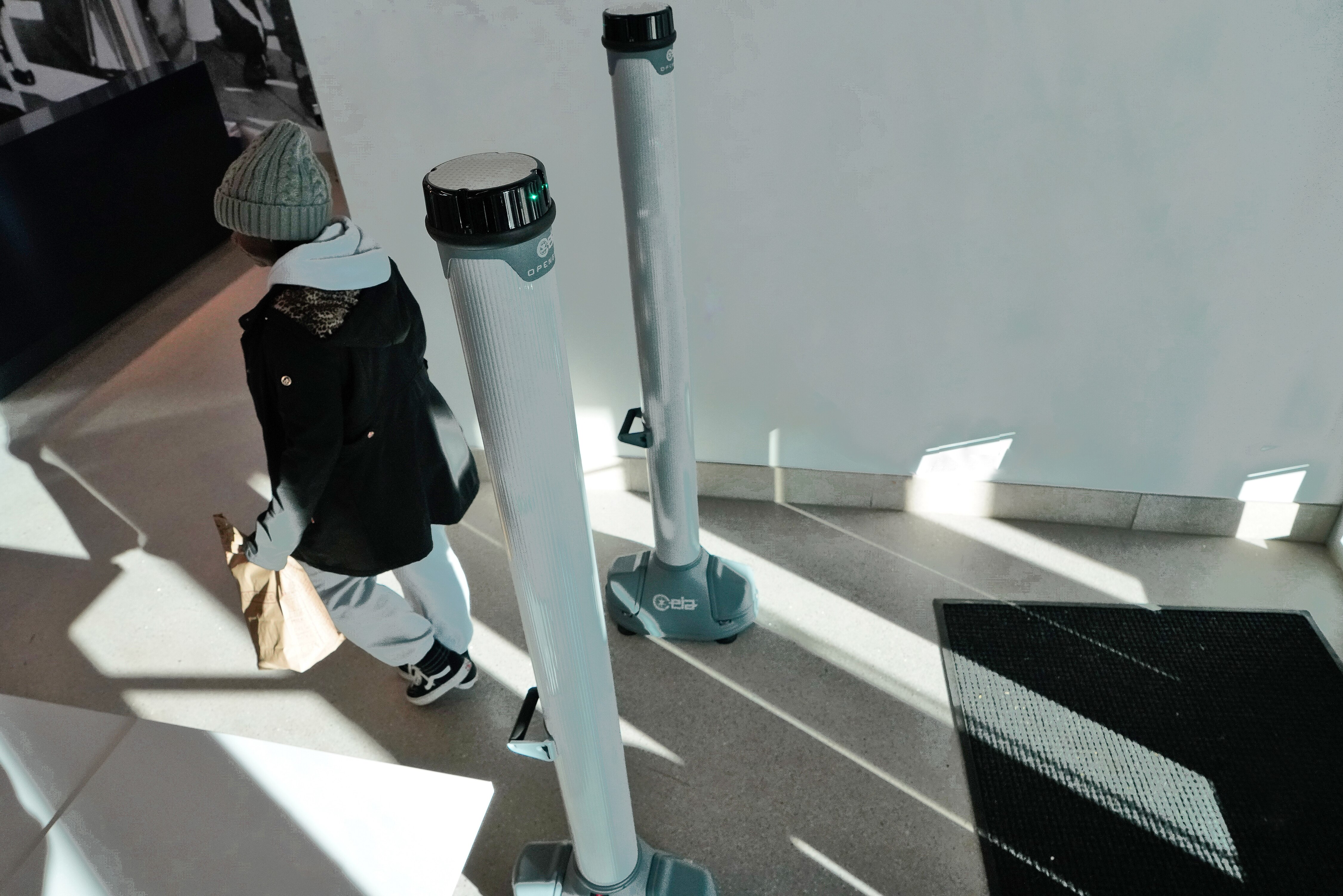 A student walks through metal detectors that were installed in the dorms at Morgan State.