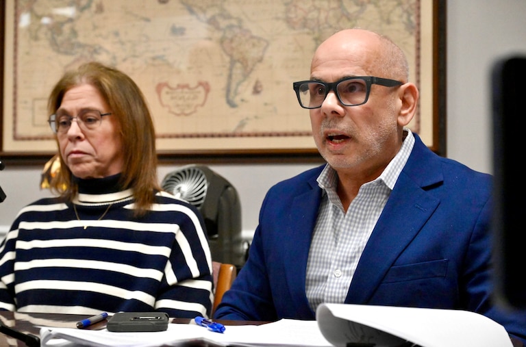 Attorney Michael Belsky, right, speaks at a press conference in Silver Spring on Friday about circumstances surrounding the death of Robert Fuller, Jr., at Cogir Senior Living last month. He is joined by Suzanne Caron, left, daughter of Linda Buttrick, who was Fuller's longtime partner and who lived with him.