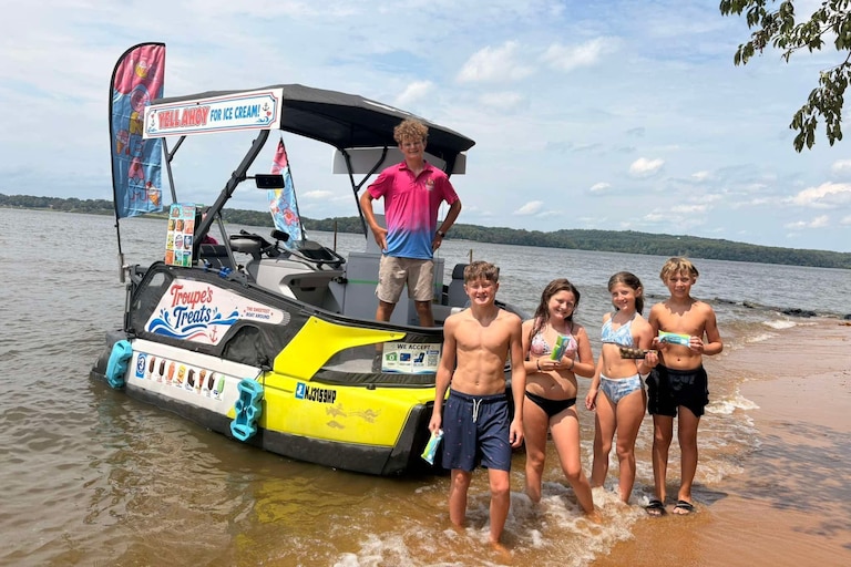 Brian Troupe, left, is selling about $2,000 worth of ice cream from a converted Seadoo on the Bohemia, Elk and Sassafras rivers.