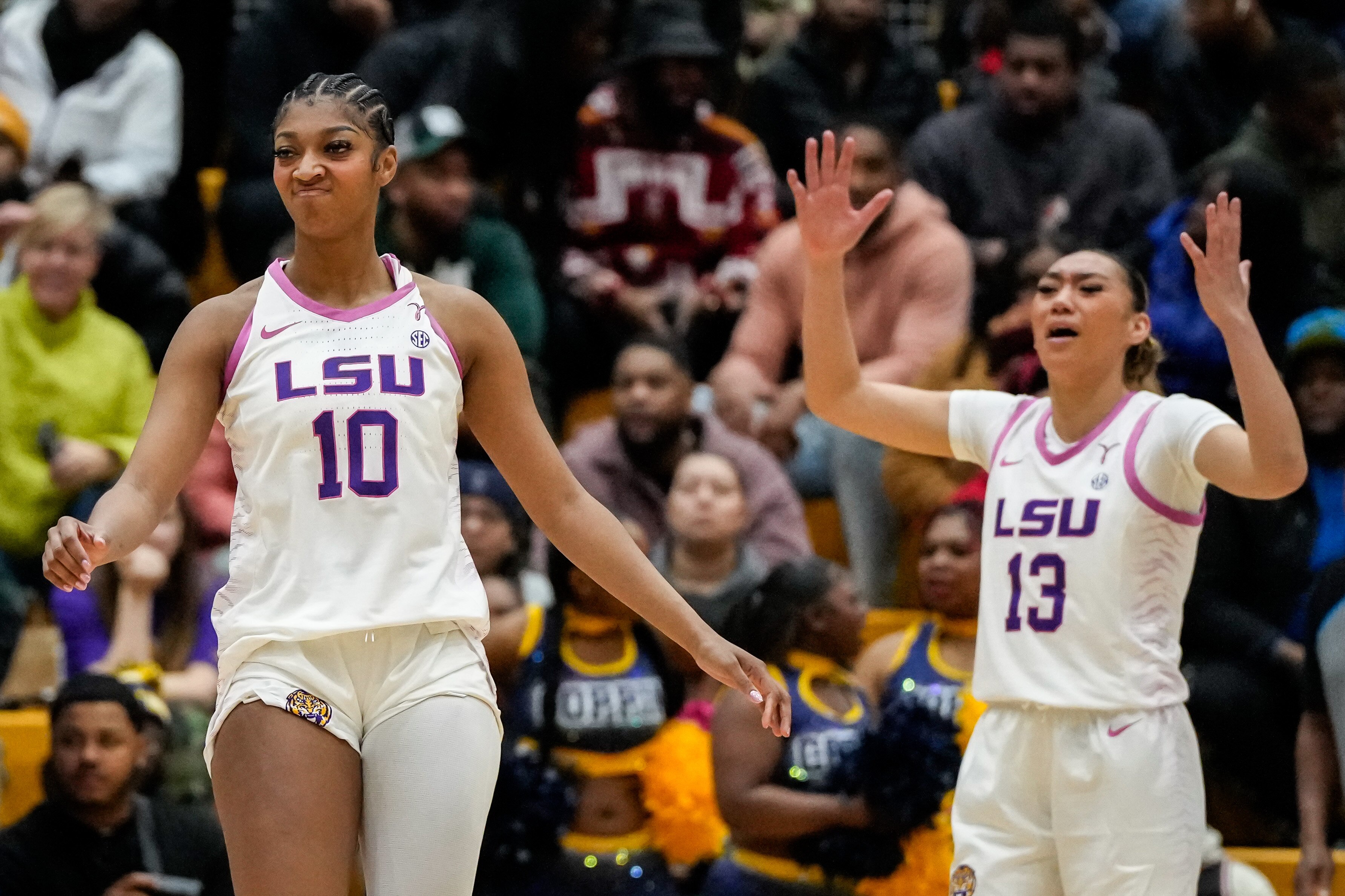 Angel Reese (10) and LSU teammate Last-Tear Poa like what they see during the third quarter of the Tigers' 80-48 win at Coppin State on Wednesday night.