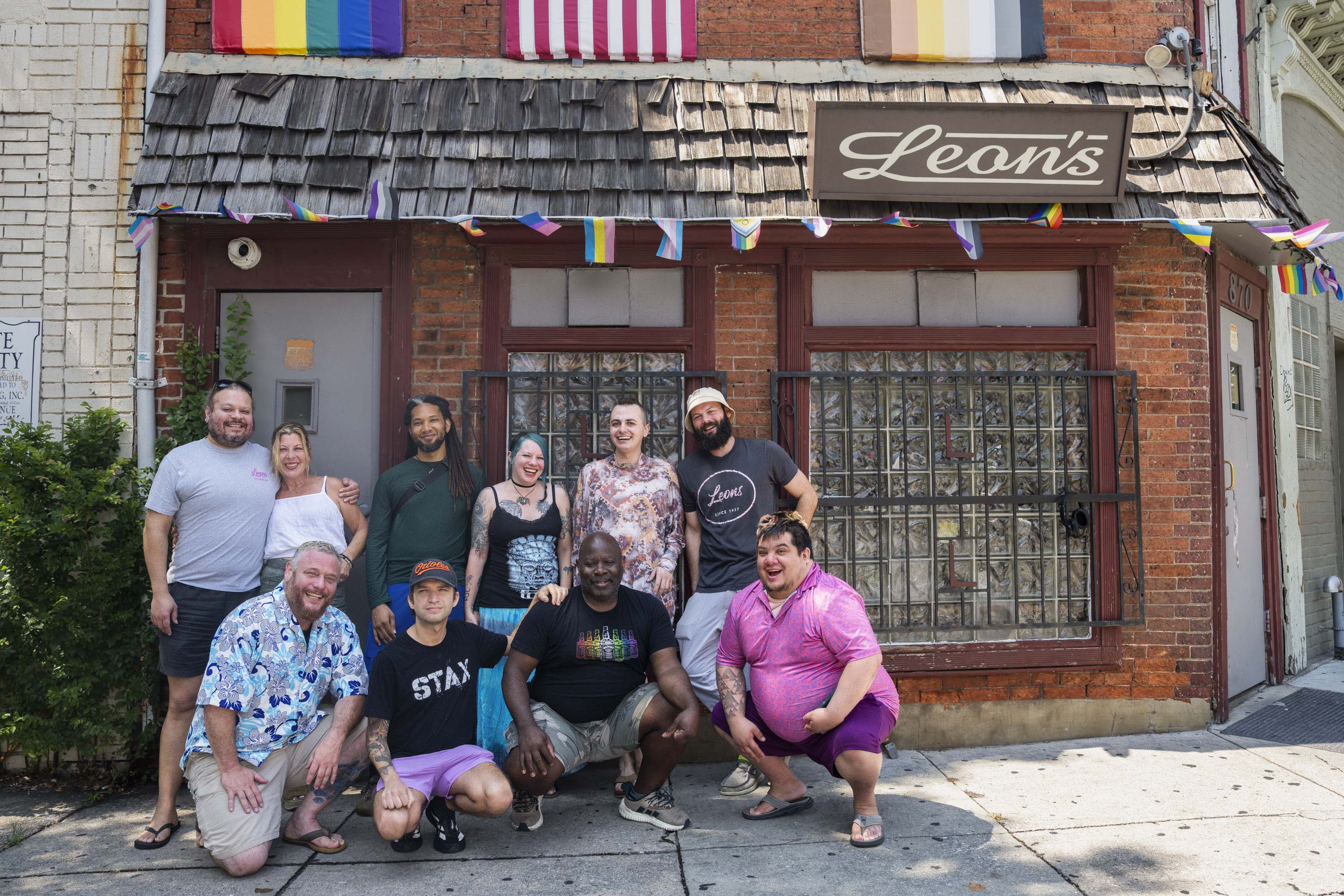 Leon’s opened in Mount Vernon in the 1950s and bore witness to many eras of the city’s evolving queer culture. From left, Leon’s staffers Stacey Antoine, Karen O’Donnell, Joseph Leloudis, Damon Wallace, Brandon Gruszczynski, Tina Wallace, Sanchez Sanders, Cade Granger, Adam David Bencomo, and Sam Smith.