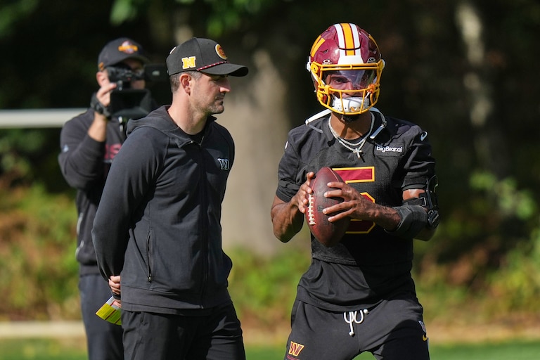 Washington Commanders' quarterback Jayden Daniels holds the ball during practice Friday.