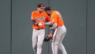 Baltimore Orioles right fielder Leody Taveras, right, congratulates center fielder Colton Cowser after he robbed Colorado Rockies' Jake McCarthy of a two-run, walkoff home run to end the ninth inning.
