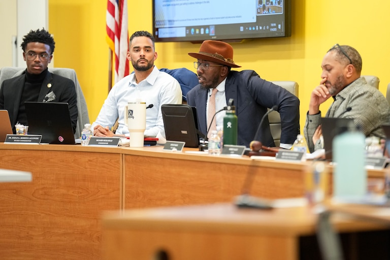From left: Baltimore City Board of School Commissioners Dylan Rooks, Dr. Stefan Redding-Lallinger, Mujahid Muhammad and chair Robert Salley converse during a meeting at their headquarters on North Ave. in Baltimore, Md. on Tuesday, January 14, 2025.