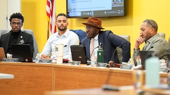 From left: Baltimore City Board of School Commissioners Dylan Rooks, Dr. Stefan Redding-Lallinger, Mujahid Muhammad and chair Robert Salley converse during a meeting at their headquarters on North Ave. in Baltimore, Md. on Tuesday, January 14, 2025.