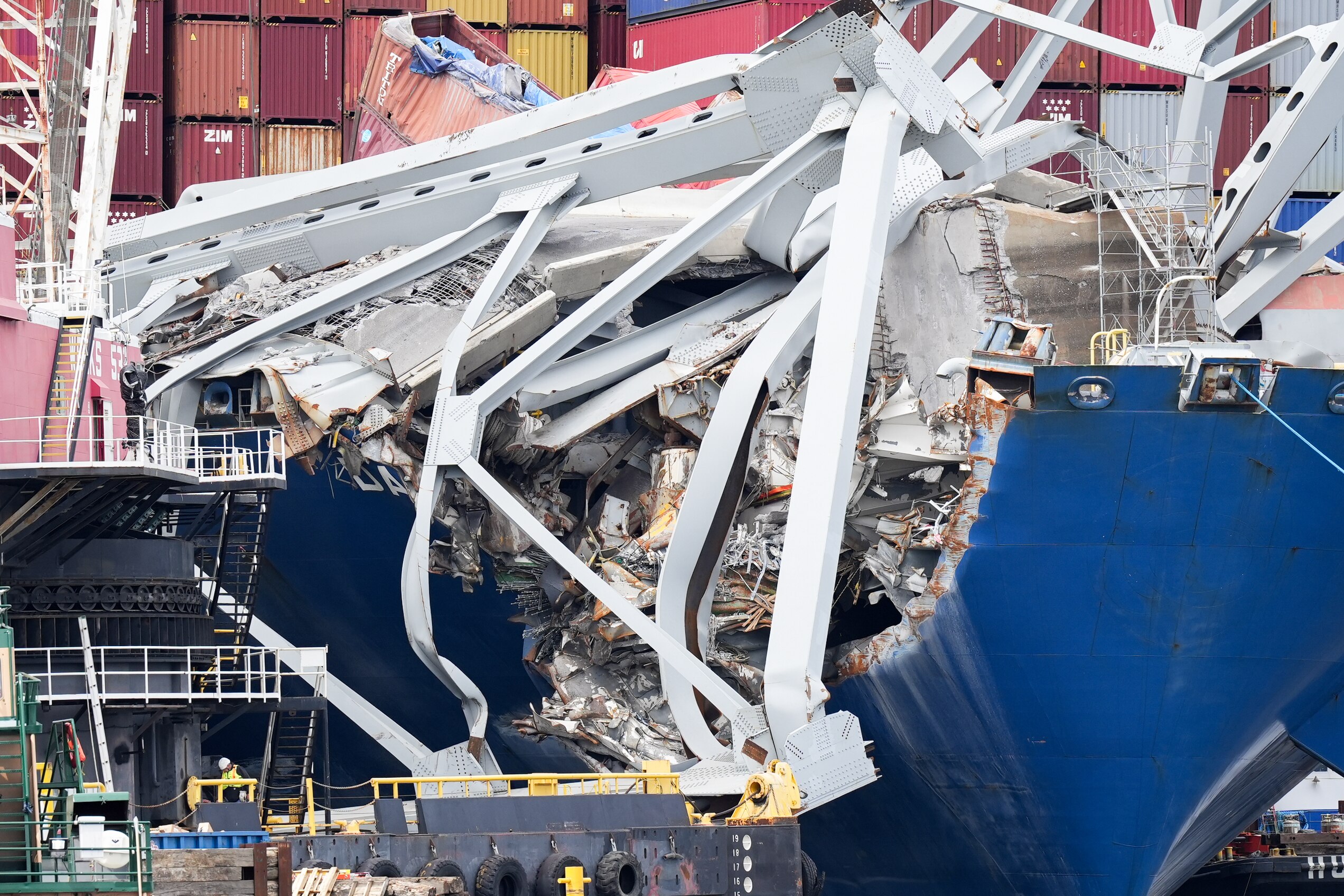 Wreckage from the collapsed Francis Scott Key bridge is seen on top of the cargo ship Dali from a boat in the Patapsco River on April 25, 2024.