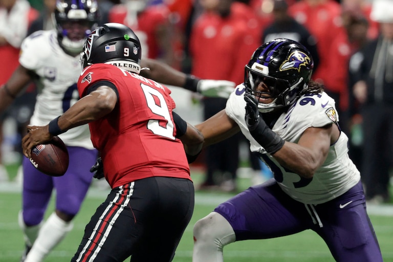 Baltimore Ravens linebacker Tavius Robinson (95) pressures Atlanta Falcons quarterback Michael Penix Jr. (9)