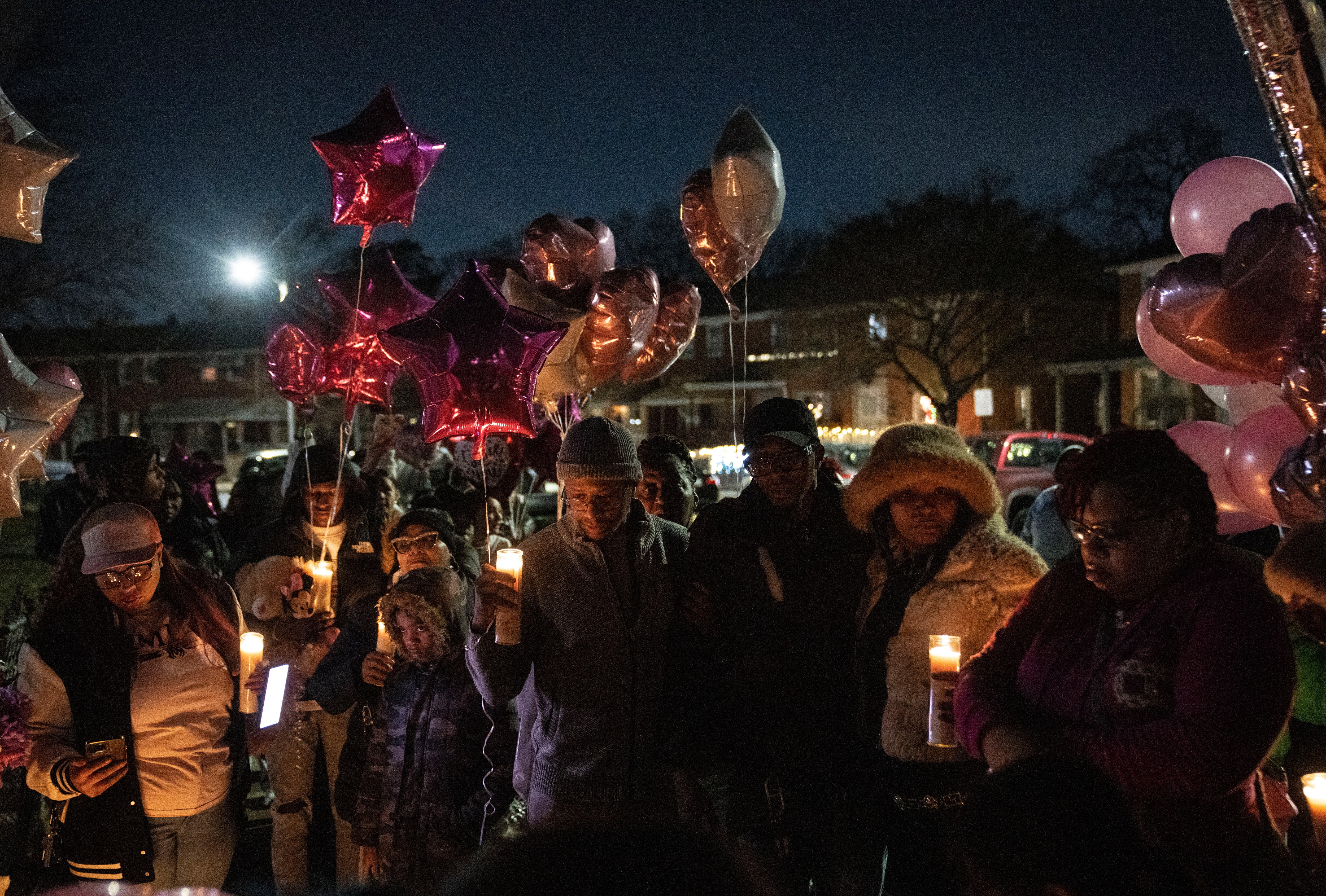 Family members and community members gather at the vigil for 11-year-old London Olsen, in Essex, Tuesday, January 28, 2025.