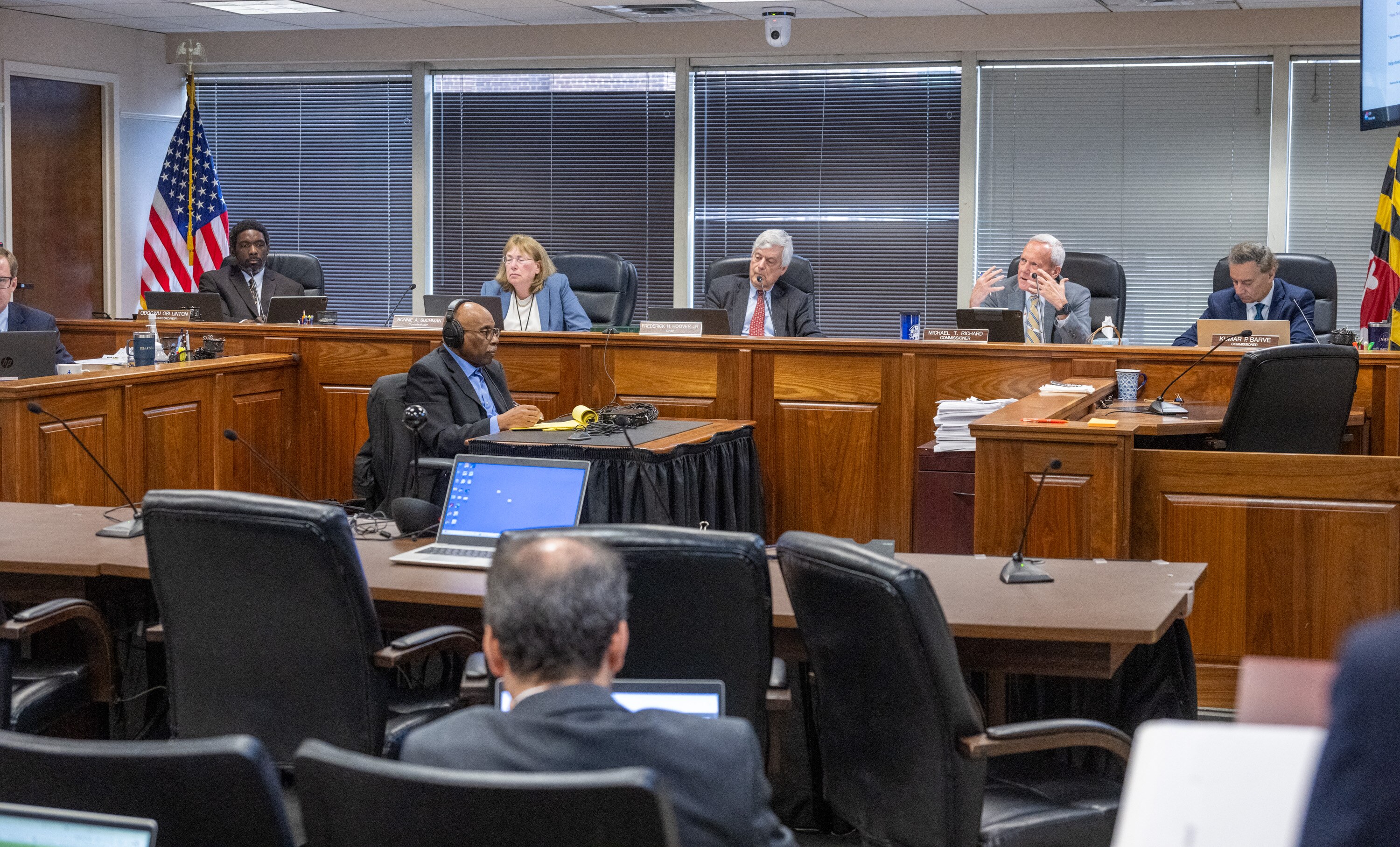 PSC commissioners question Staff witness Roger Austin about a proposed transmission line project during a Maryland Public Service Commission meeting on May 21, 2025.