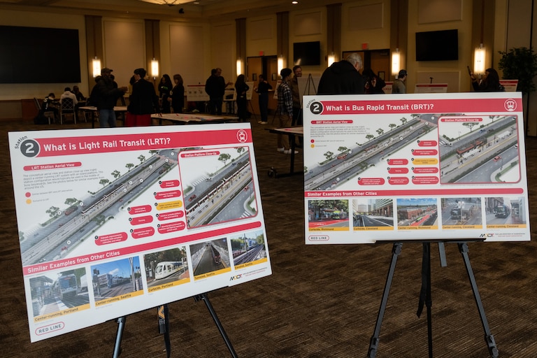 Boards explaining the differences between Light Rail Transit and Bus Rapid Transit at the Maryland Transit Administration’s Red Line open house at the University of Maryland, Baltimore’s SMC Campus Center on Saturday, Nov. 4, 2023.