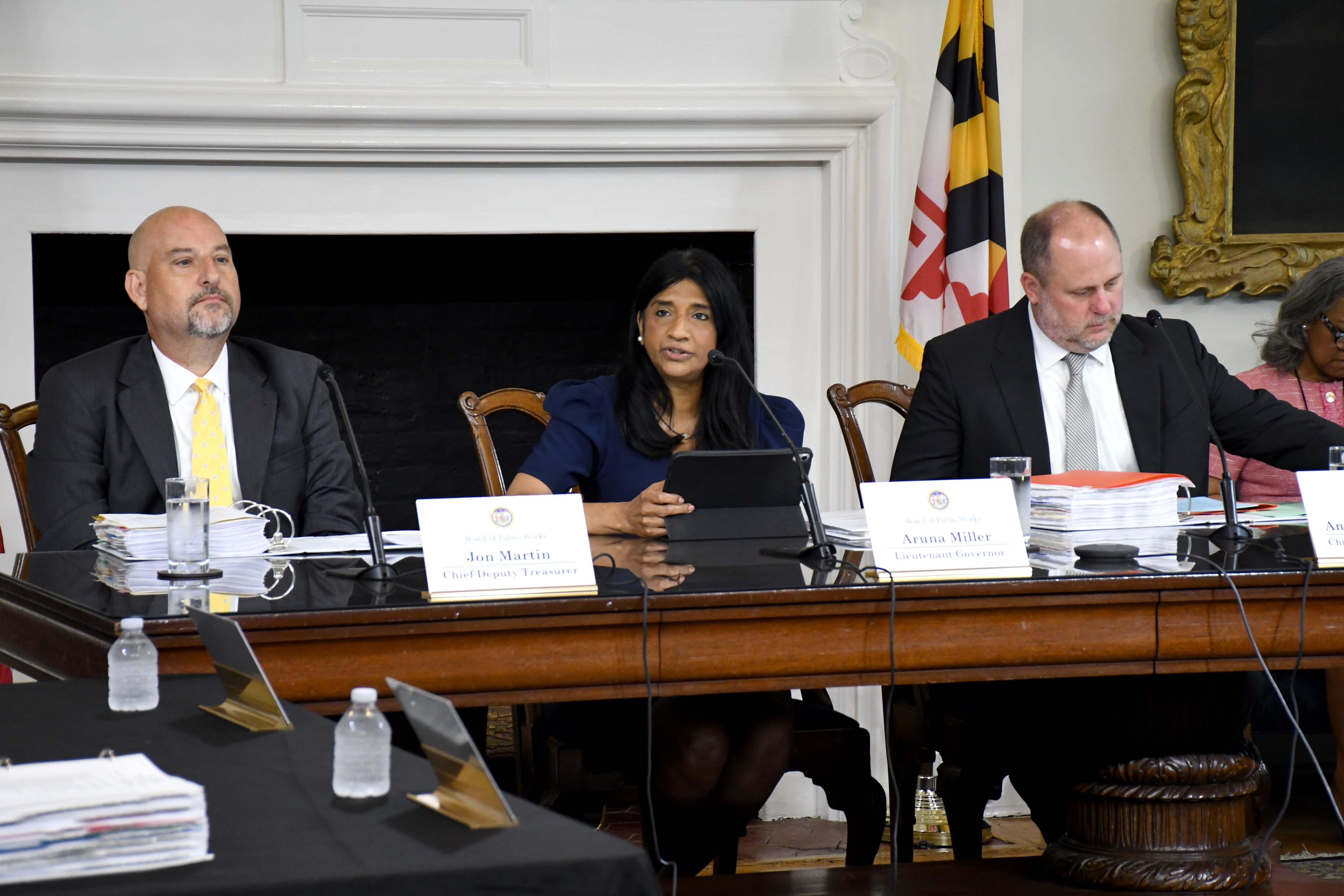 Lt. Gov. Aruna Miller, center, leads a meeting of the Maryland Board of Public Works at the State House in Annapolis on Wednesday, July 2, 2025. She is joined by, at left, Chief Deputy Treasurer Jon Martin and, at right, Chief Deputy Comptroller Andrew Schaufele. The meeting represented the first time in at least 30 years that all three board positions were filled by substitute members.