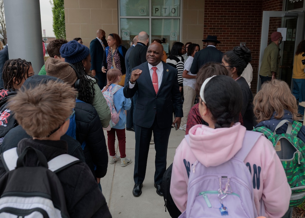 Dr. Jermaine Dawson, the new CEO of Baltimore City Public Schools, chats with 5th graders outside of Medfield Heights Elementary School.