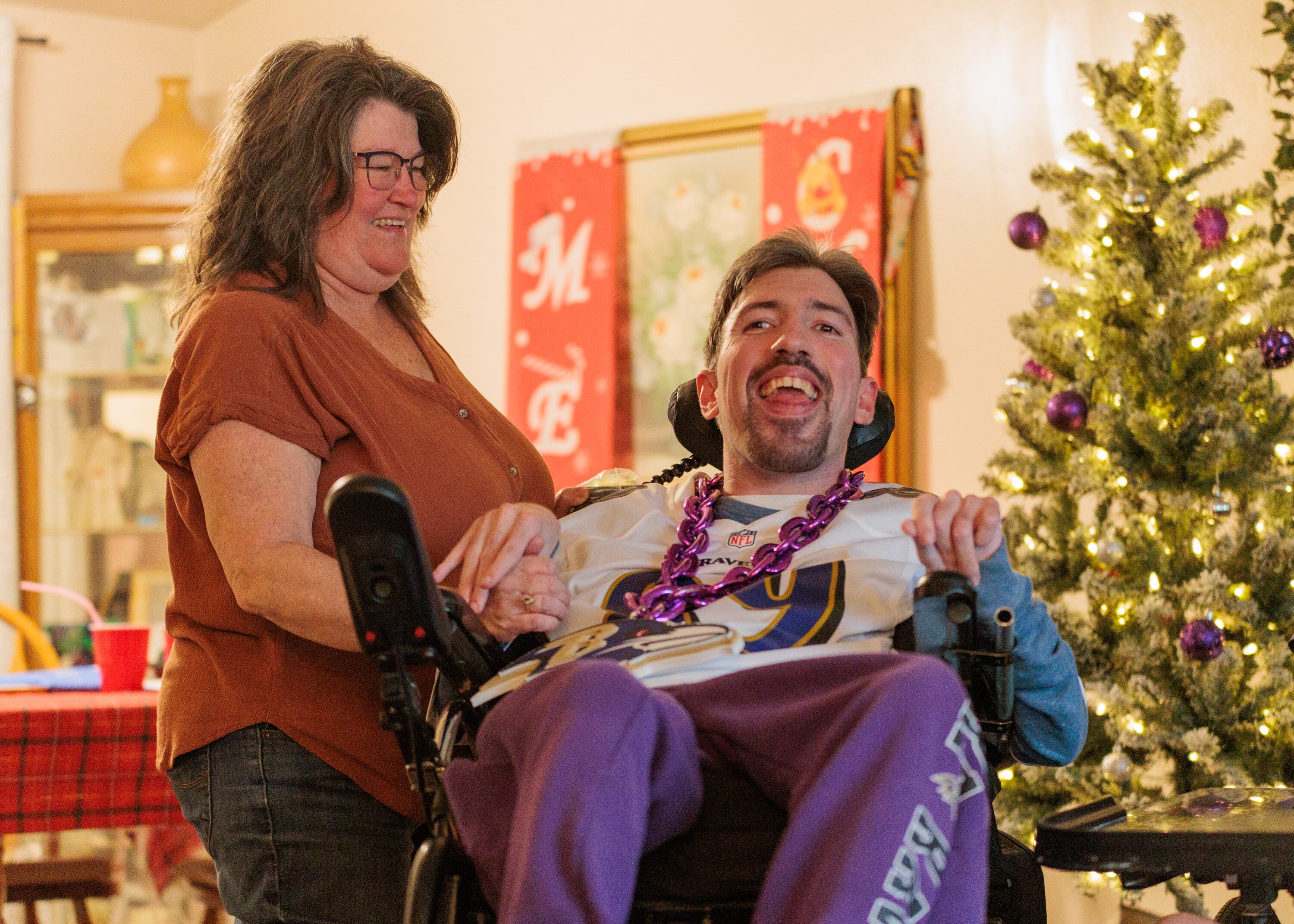 Sherry Price and her son David in their living room in Glen Burnie, MD, on Dec. 13, 2024.