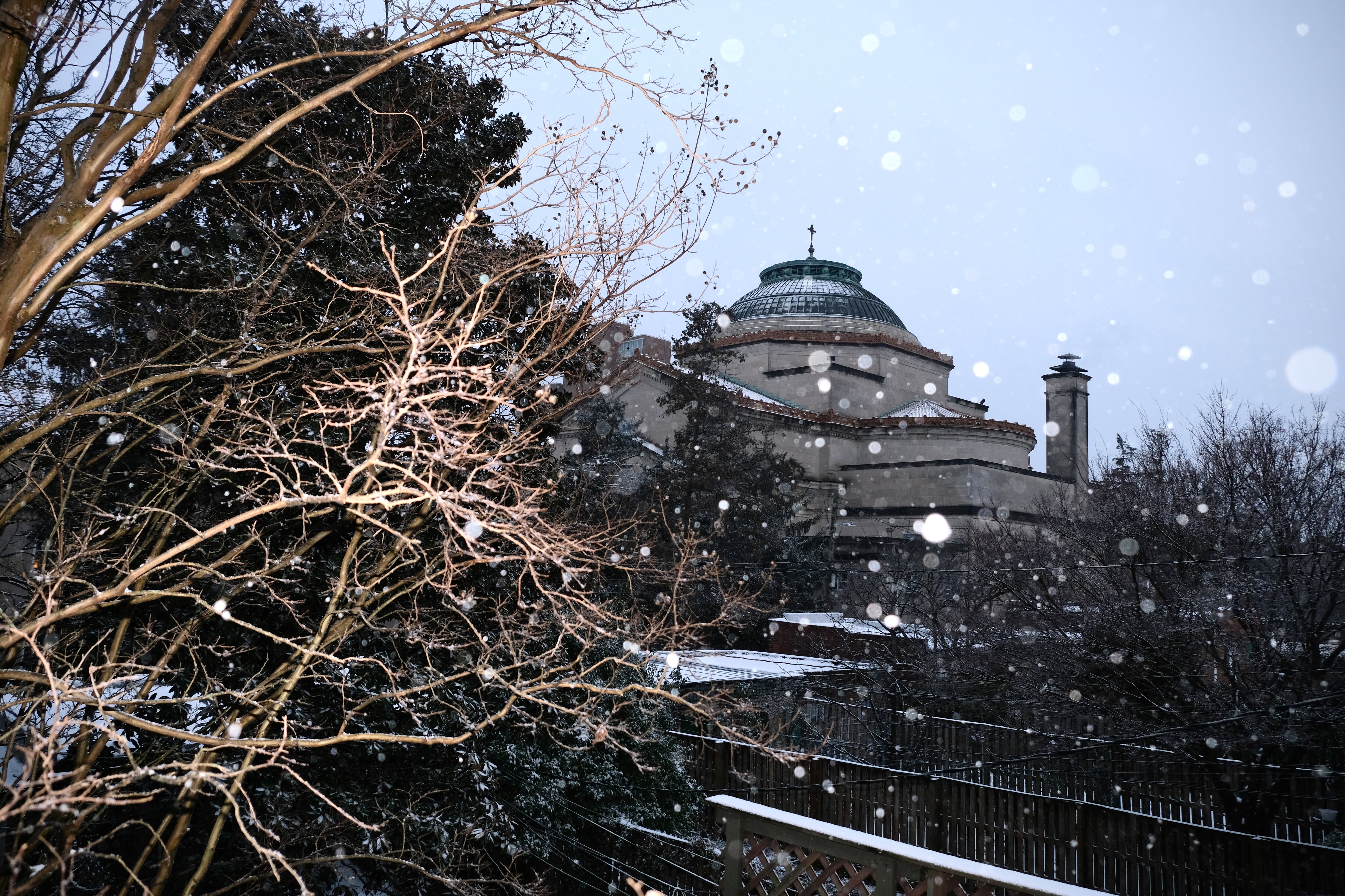 Snow falls in Charles Village on Sunday. Up to 3 inches of snow by day’s end in Baltimore and 4 or 5 inches north of the city, according to the National Weather Service, along with bitterly cold temperatures.
