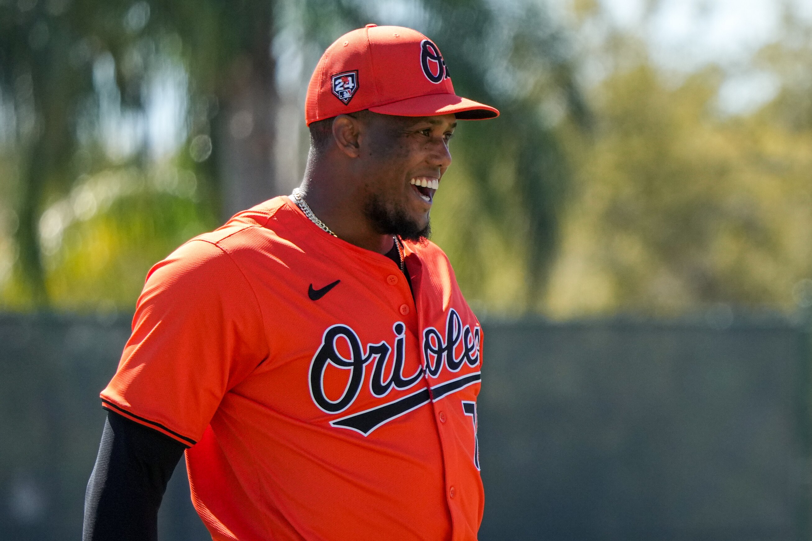 Baltimore Orioles relief pitcher Yennier Cano (78) laughs as he returns to the dugout during the team’s spring training session at Ed Smith Stadium on Feb. 22, 2024.
