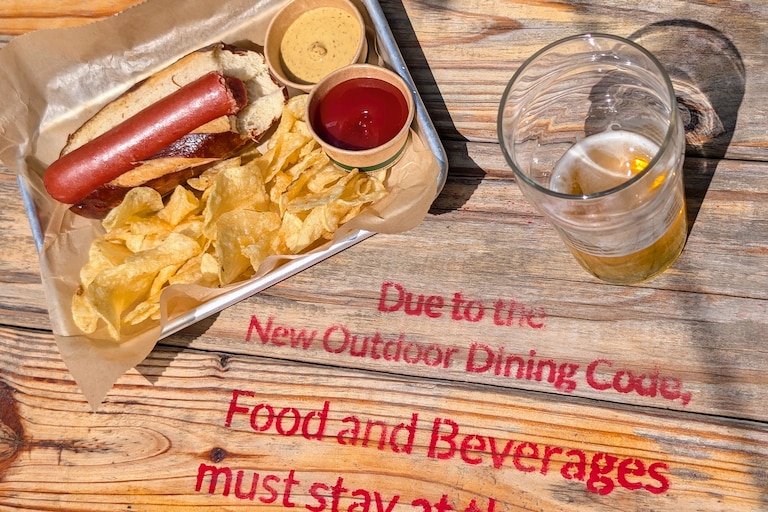 You can order a hot dog at Forward Brewing in Annapolis, but rules adopted by the city make it illegal to eat it standing up.