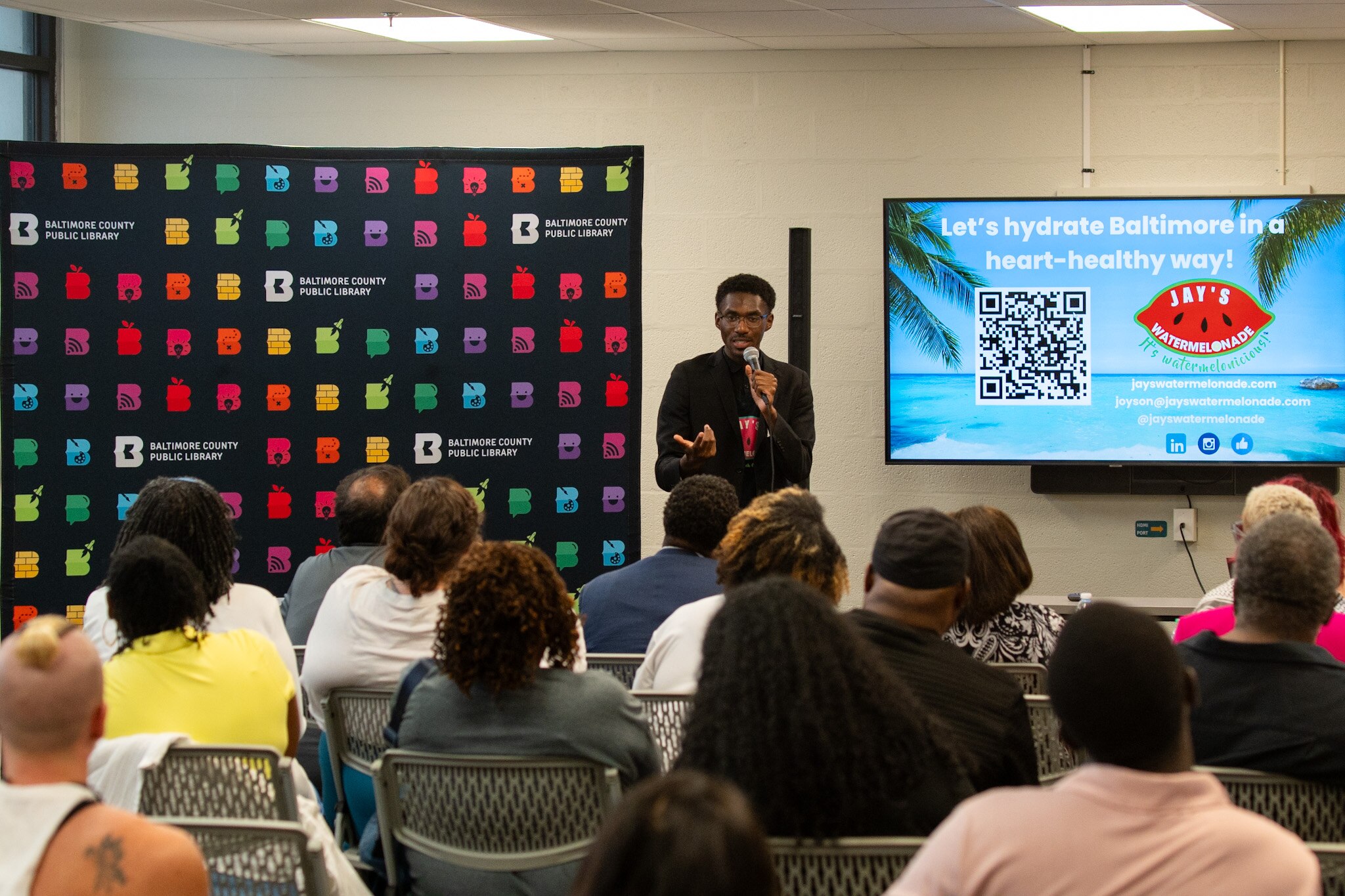 Joyson BaLisamore pitches judges about his Jay’s Watermelonade company at the small business competition held at the Randallstown Branch Library on July 17, 2024.