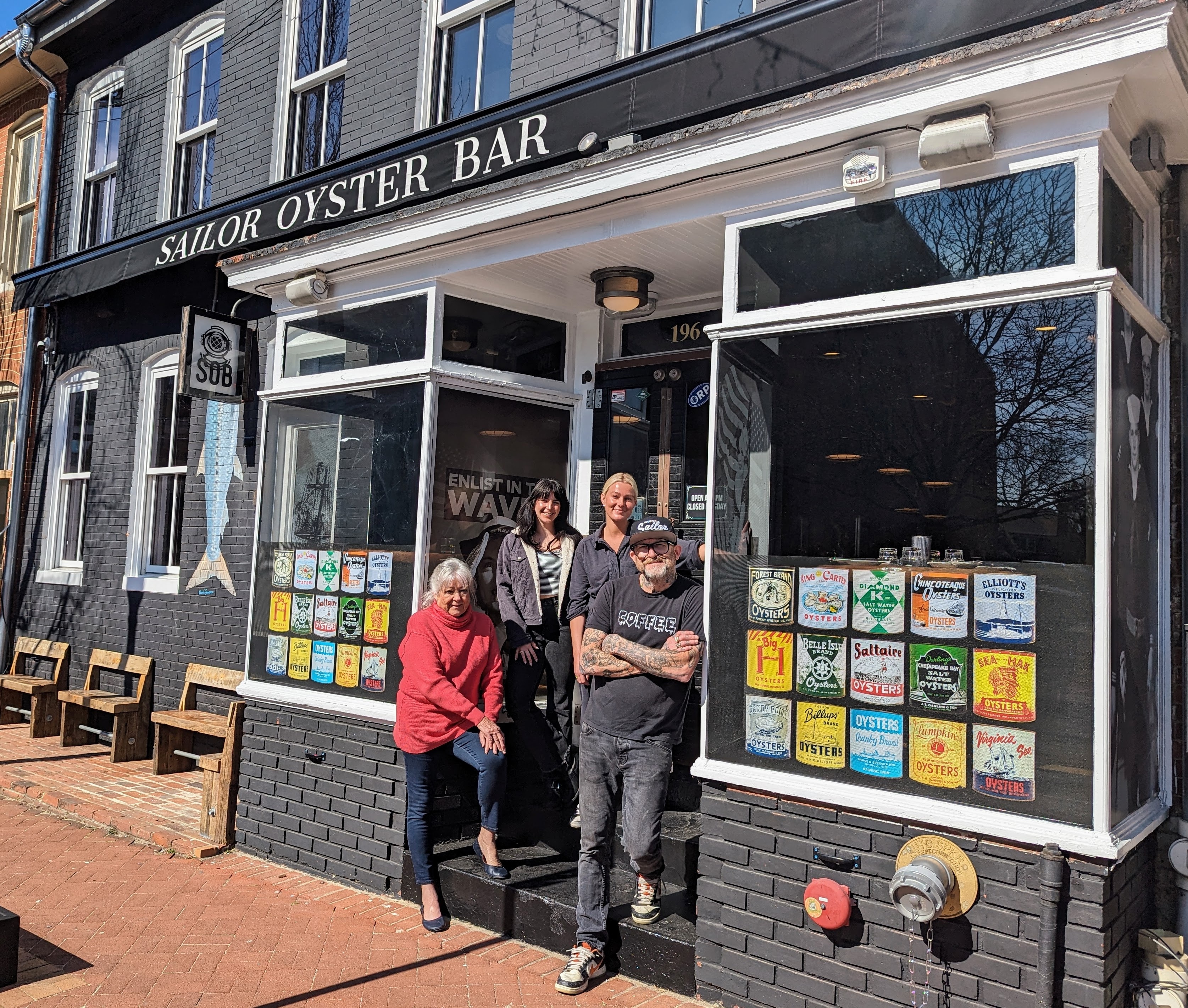 Sailor Oyster Bar co-owner Scott Herbst at his front door with, from left, his mother Gini Herbst, executive chef Lorenza Aznar and general manager Eleanore Ahern.