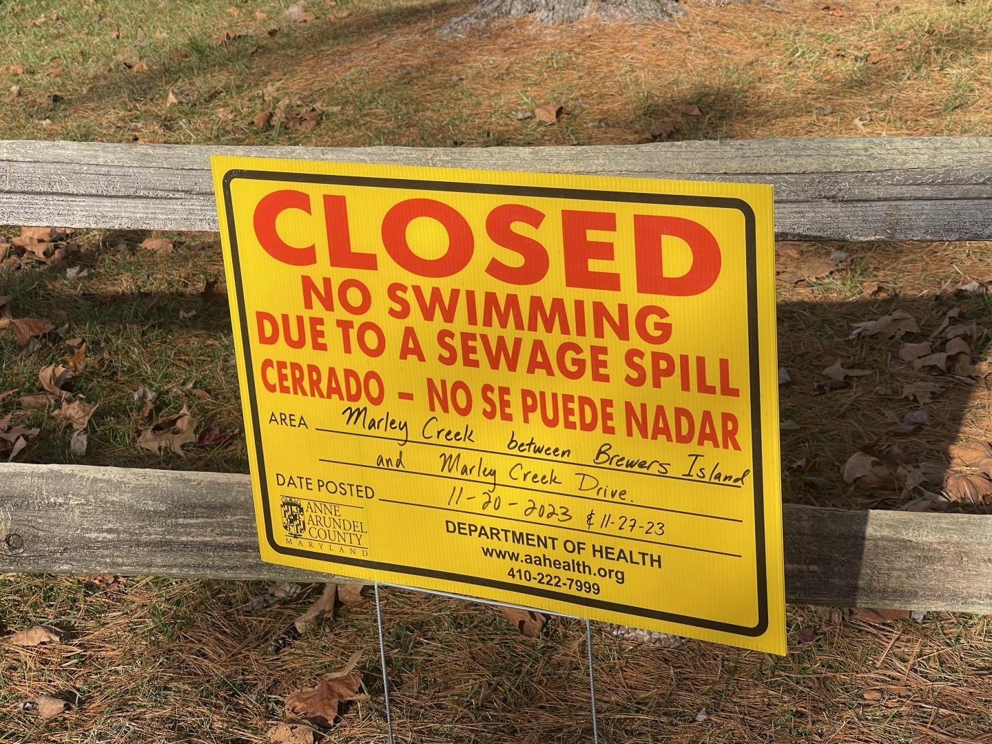 A sign warns people not to swim or engage in other water activities in Marley Creek in the fall of 2023. On July 10, 2024, the county issued a new emergency closure for the same stretch of creek after a pump failure at a nearby apartment complex.
