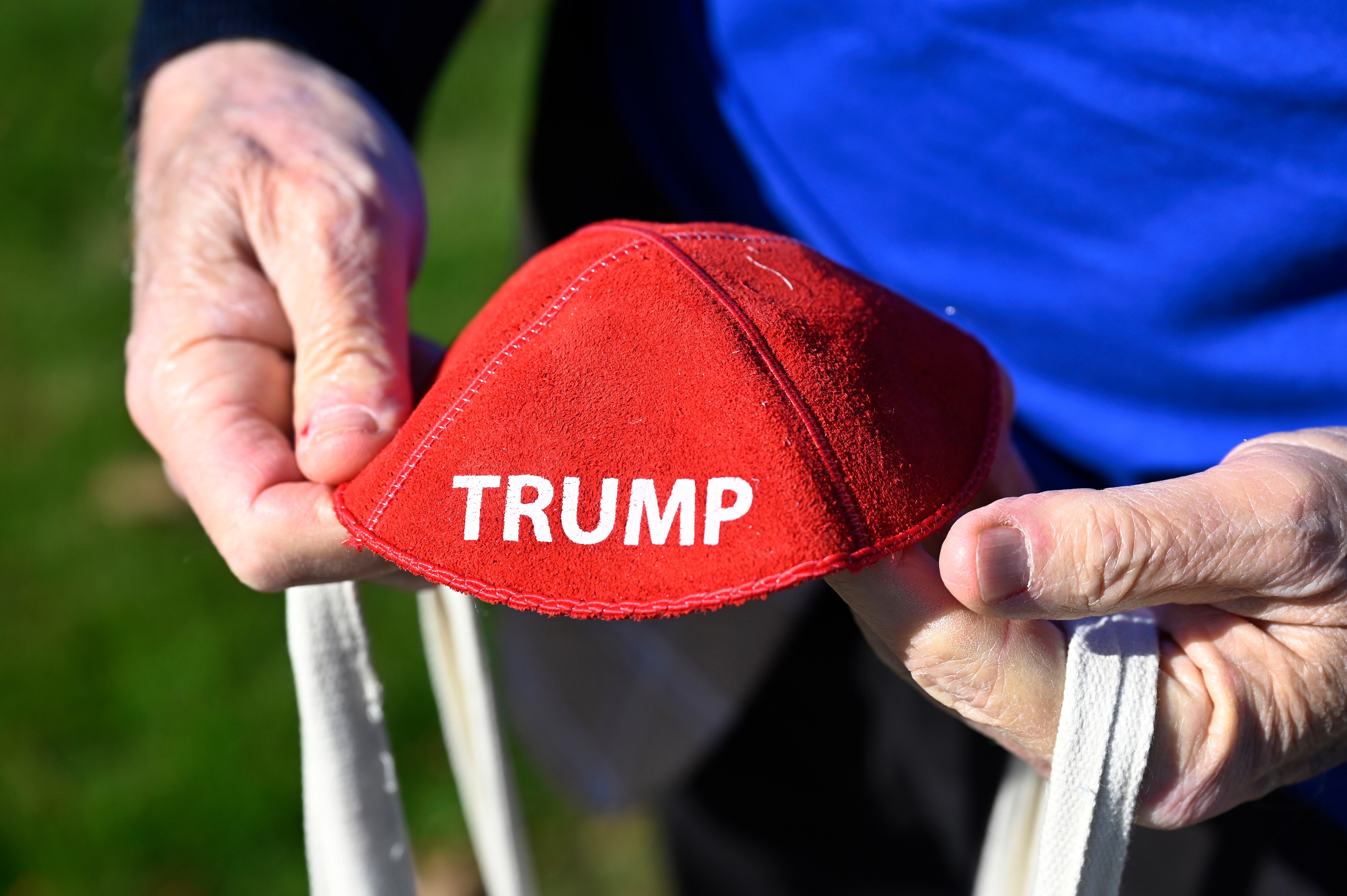 Republican Jewish Coalition member David Cuttner displays a yarmulke promoting Republican presidential nominee former President Donald Trump while canvassing a neighborhood, Sunday, Oct. 27, 2024, in West Bloomfield Township, Mich.