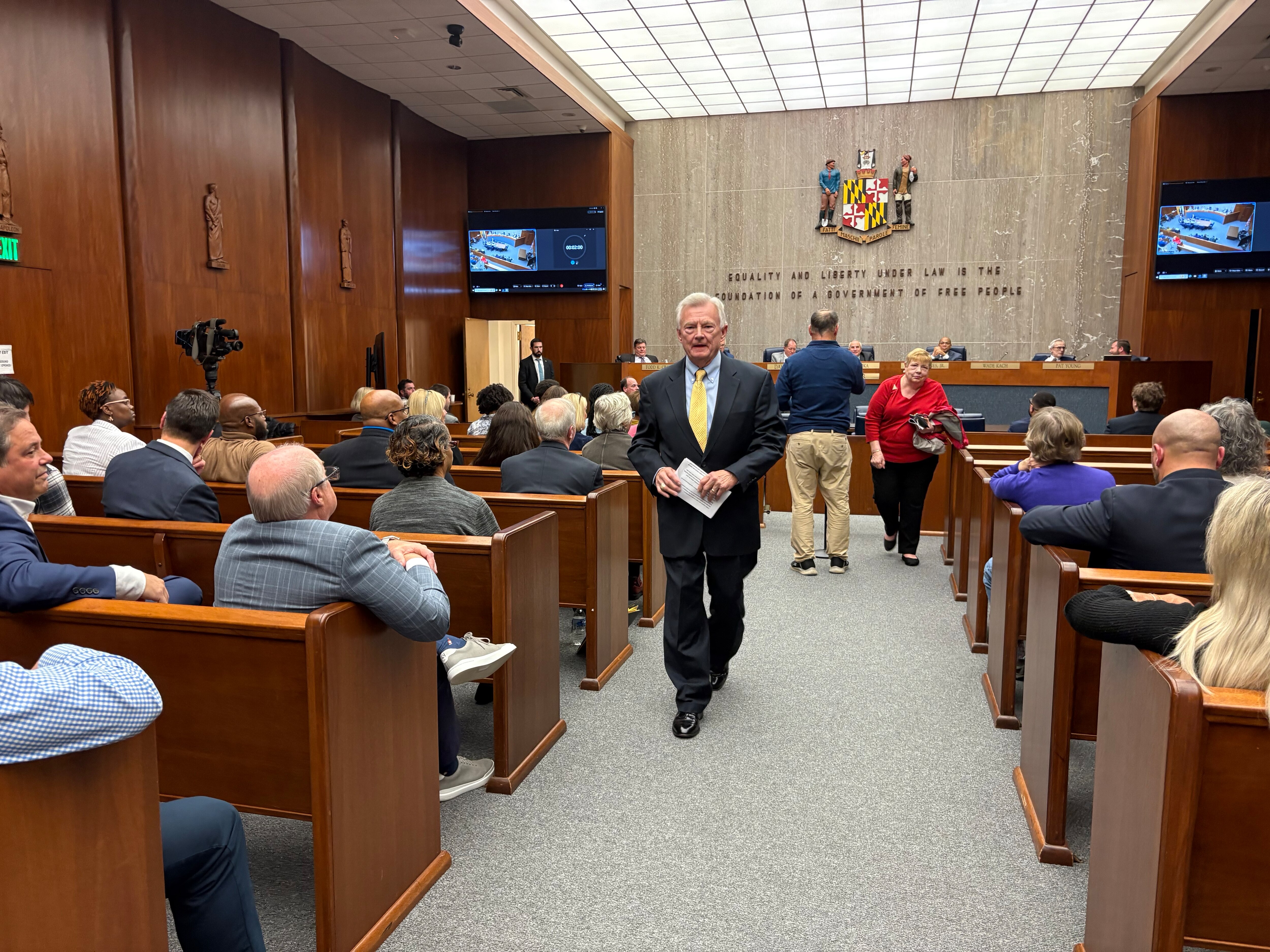 American Joe Miedusiewski, who served in the General Assembly from 1975 to 1995, finishes his testimony about the desirable qualities for a new county executive. Miedusiewski, a retired lobbyist, lives in the county.