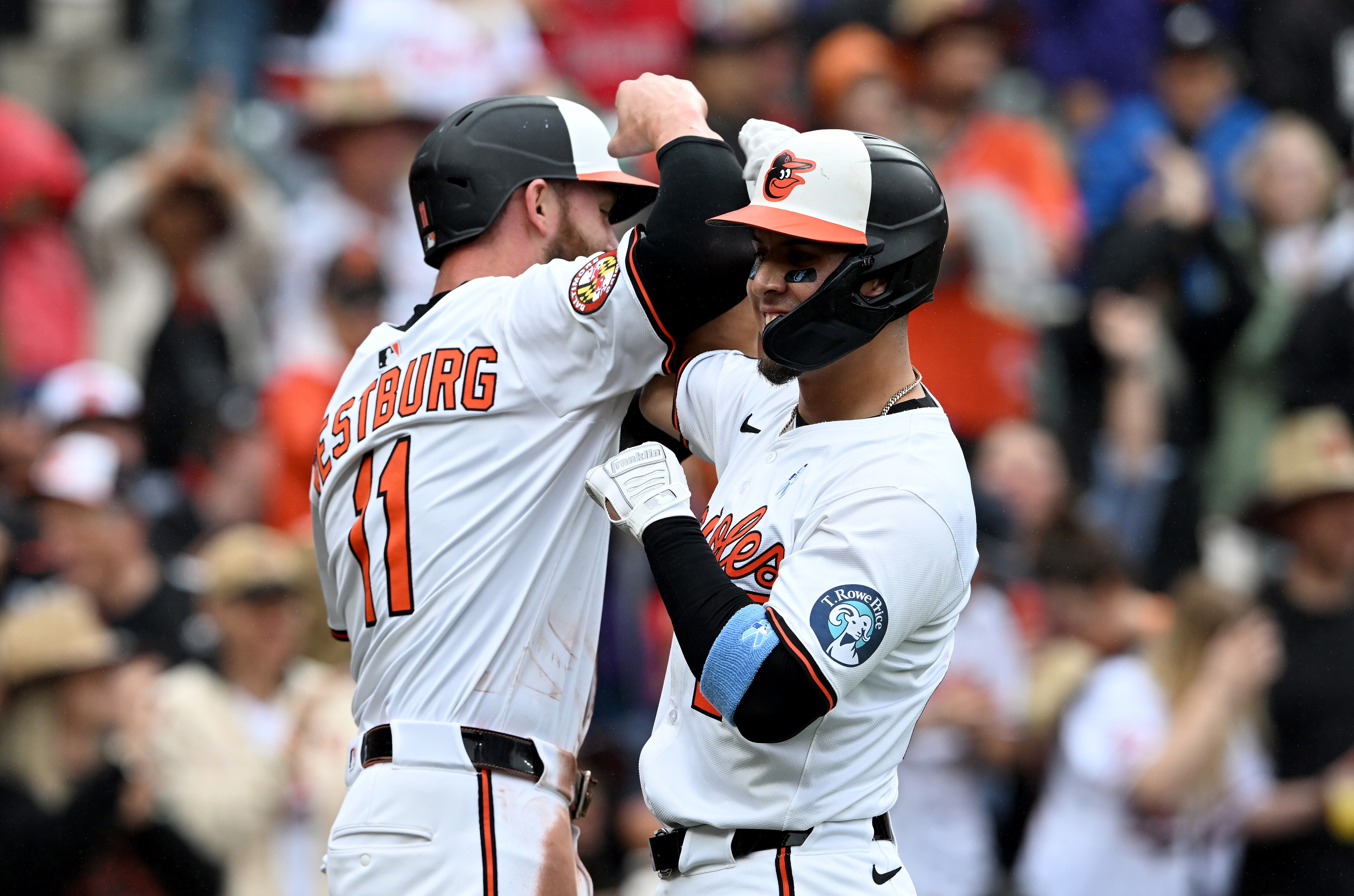 Ramón Urías celebrates with Jordan Westburg after hitting a two-run home run in the first inning Sunday at Camden Yards.