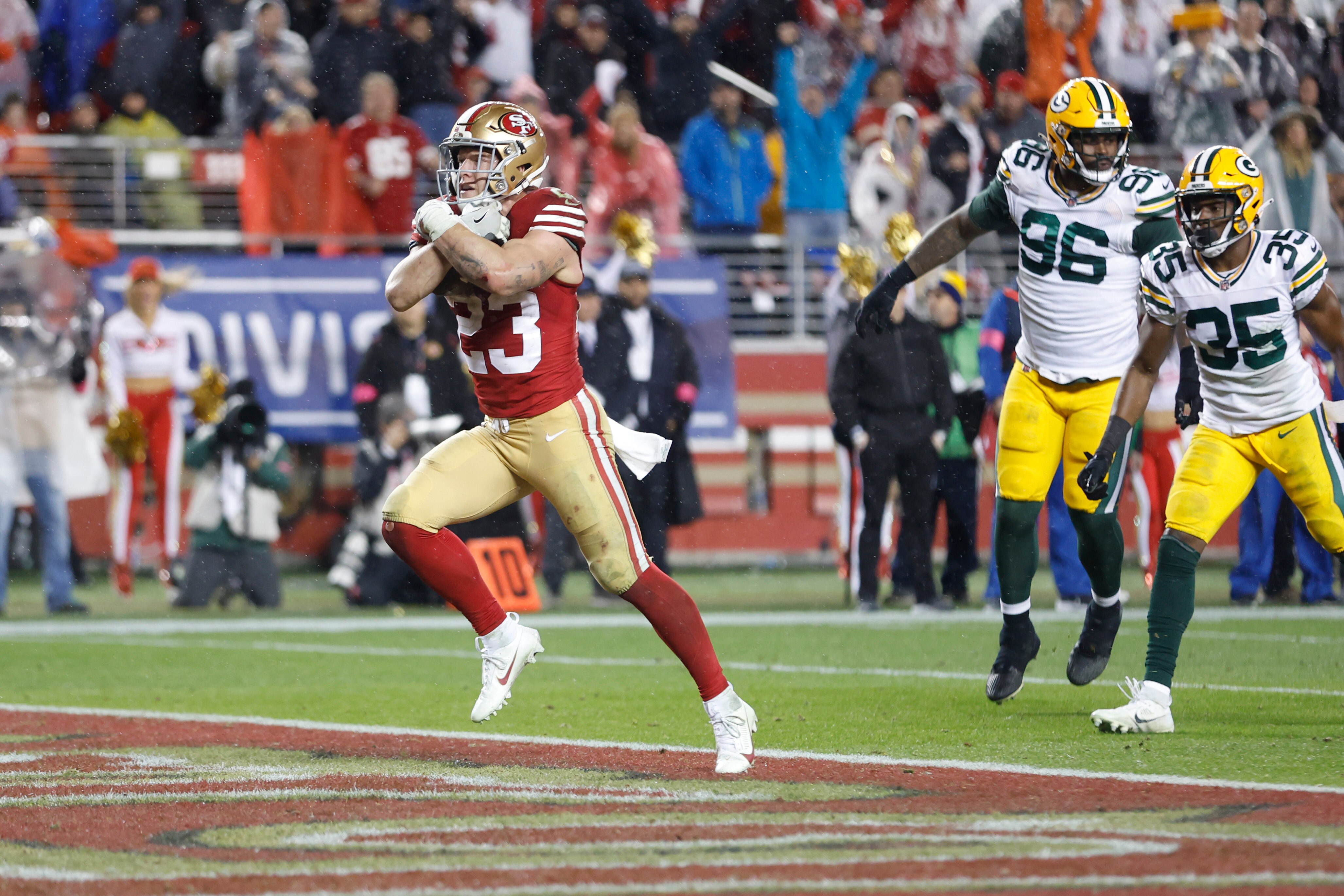 Christian McCaffrey of the San Francisco 49ers scores the game-winning touchdown Saturday night against the Green Bay Packers.