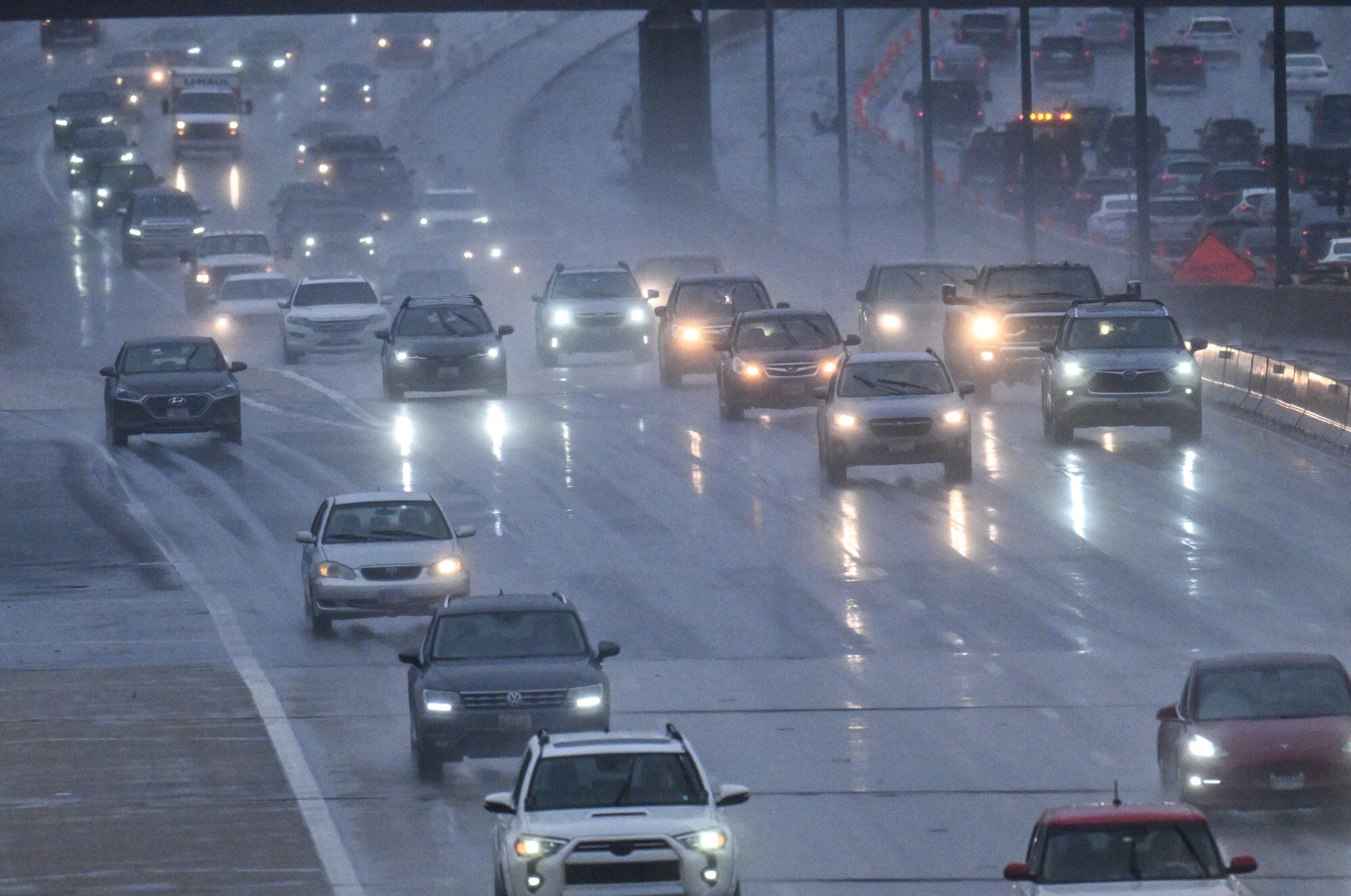 Traffic travels on the outer loop of I-695 at Falls Road as rain falls on the region.