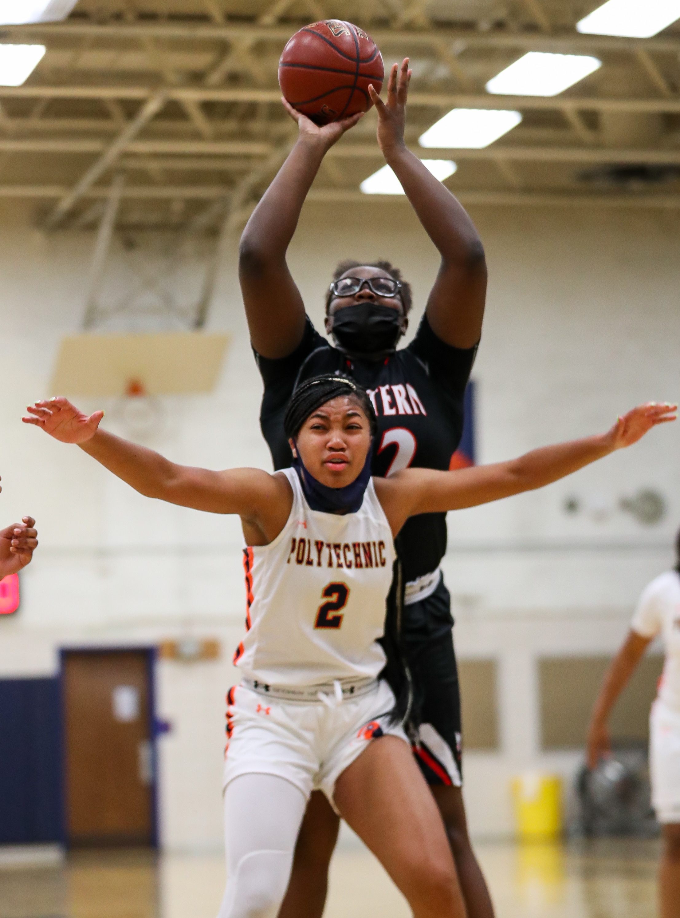 It will be a battle of state champions when Class 4A champ Western, with Breasia Colt (with ball) takes on 3A champ Poly and Taylor Addison on