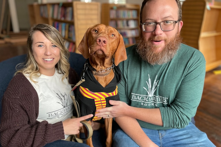 Alli and Matt Krist with their dog, Chomsky. The couple is opening Backwater Books, a bar and bookstore on Ellicott City's Main Street.
