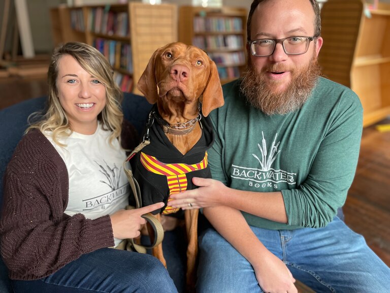 Alli and Matt Krist with their dog, Chomsky. The couple is opening Backwater Books, a bar and bookstore on Ellicott City's Main Street.